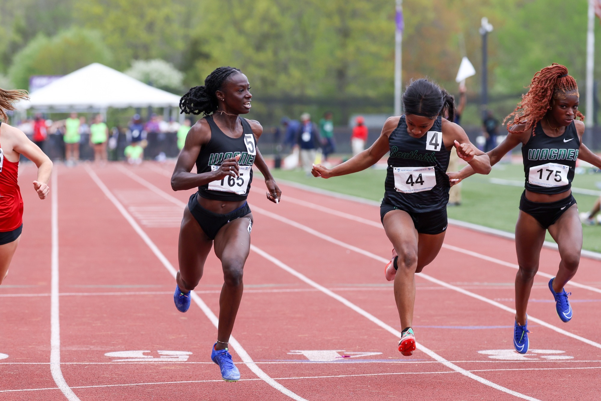 Ruth-Ann Chambers crossing the finish line at the 2025 NEC Outdoor Championship