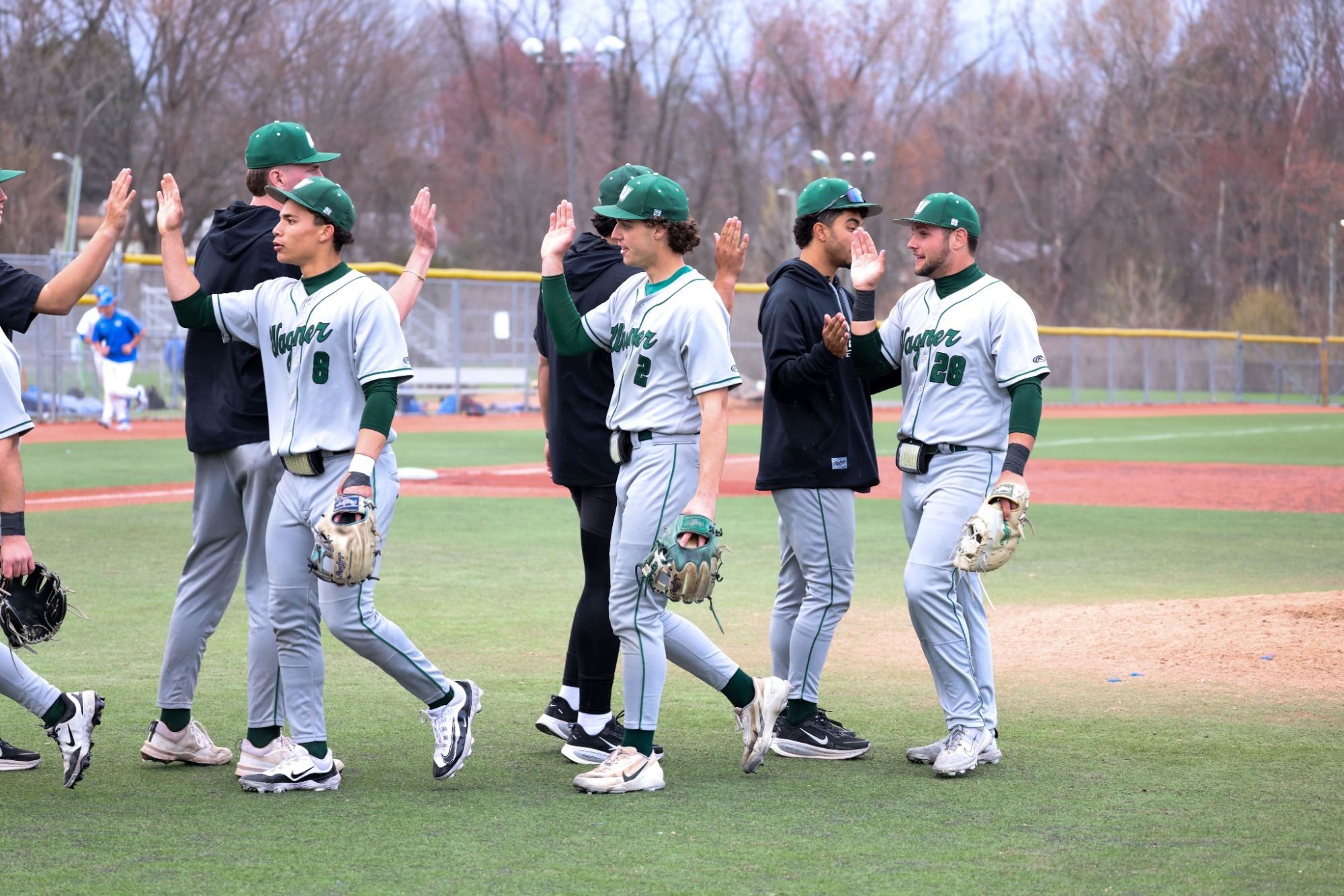 Jayden Alvarez, Dylan Immel and Joseph Mennella celebrate a win over LIU
