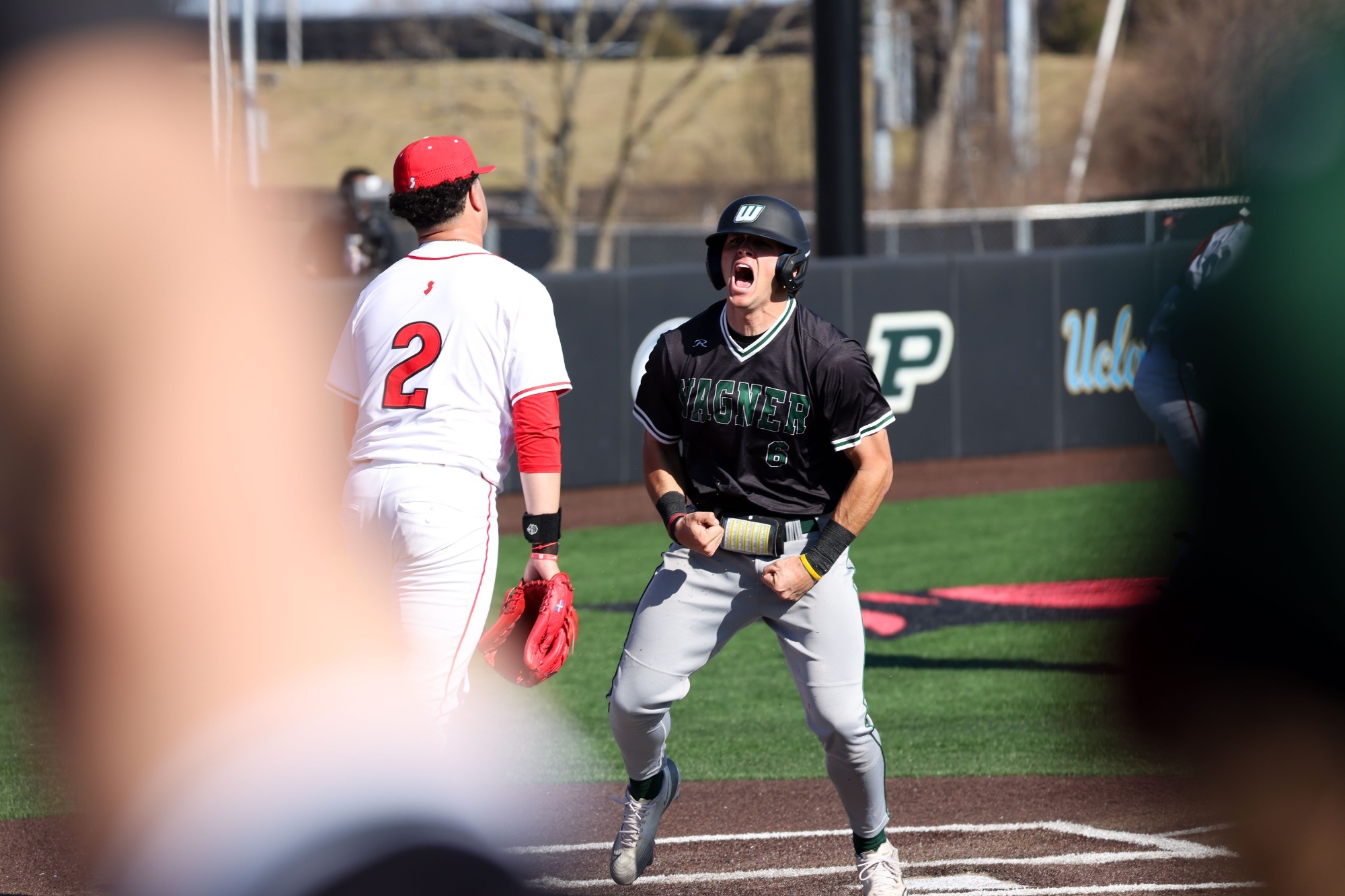 Jackson Blakley celebrates a run scored against Rutgers