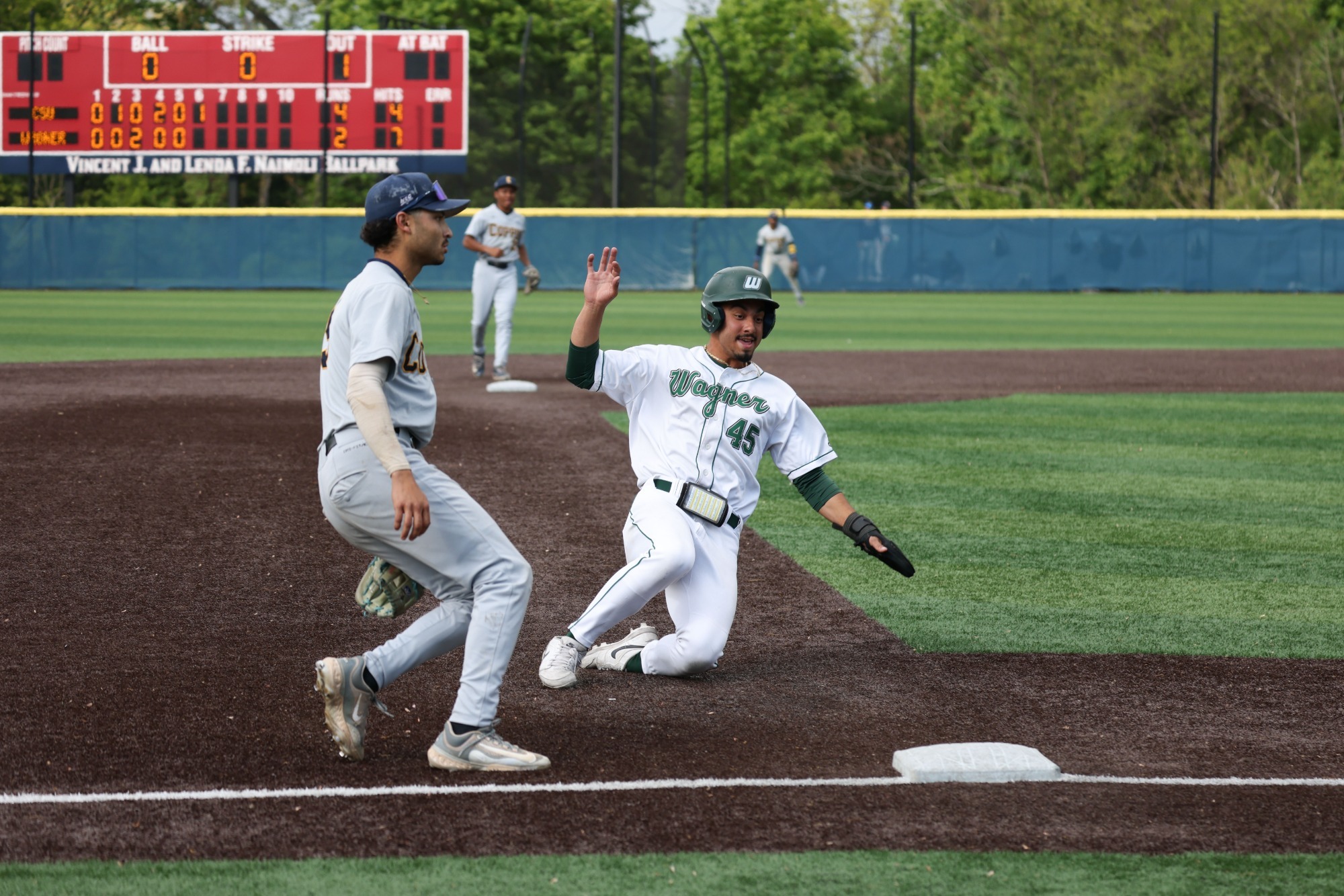 Diego Tavarez slides into third against Coppin State