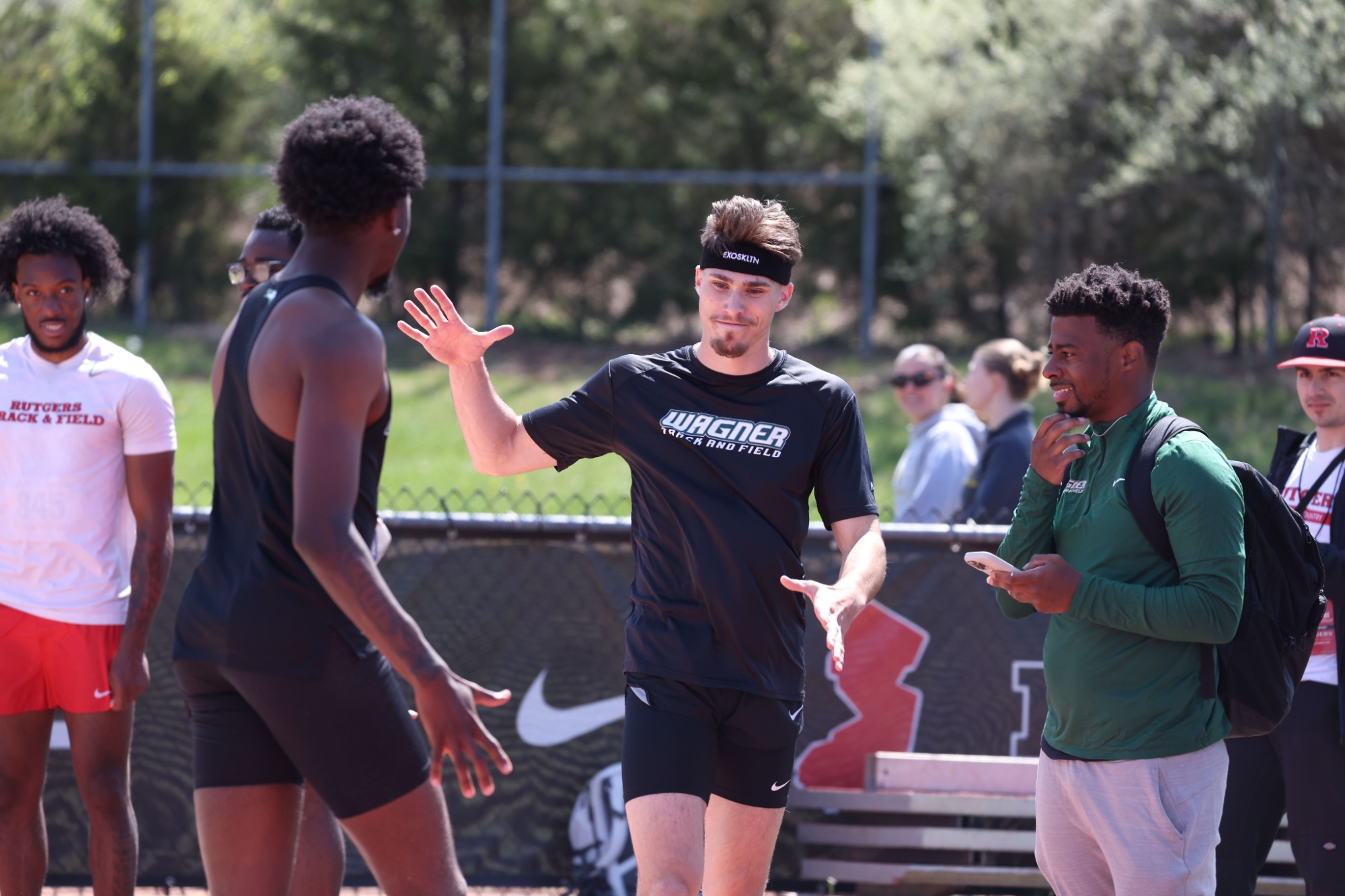 Head coach Marvin Azor celebrates with Jack Mason and Khalid Brown