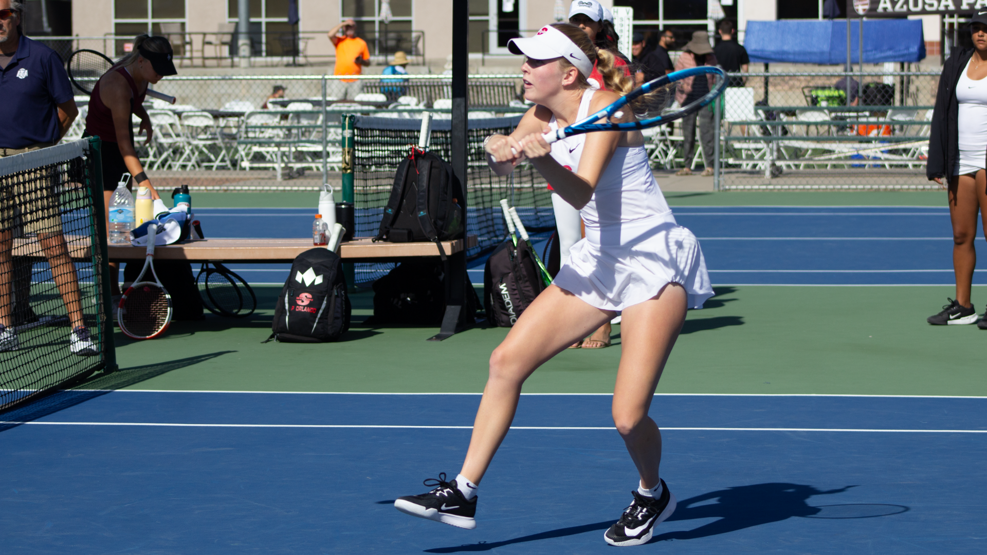 Abbigail Mulick watches the ball as she attempts to swing and make contact at the PacWest Tournament.