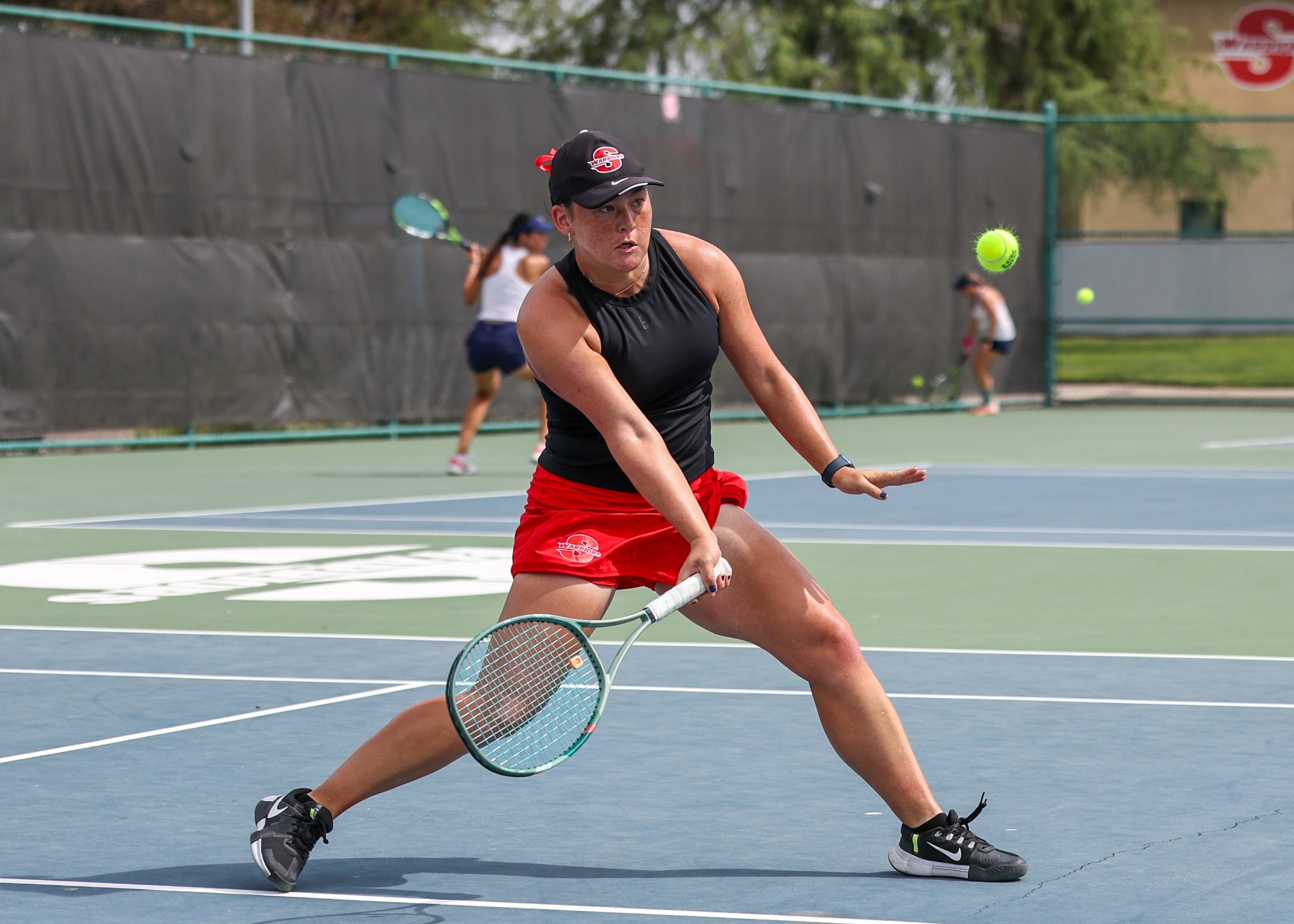 Emma Yu approaches the net to hit a dropshot.