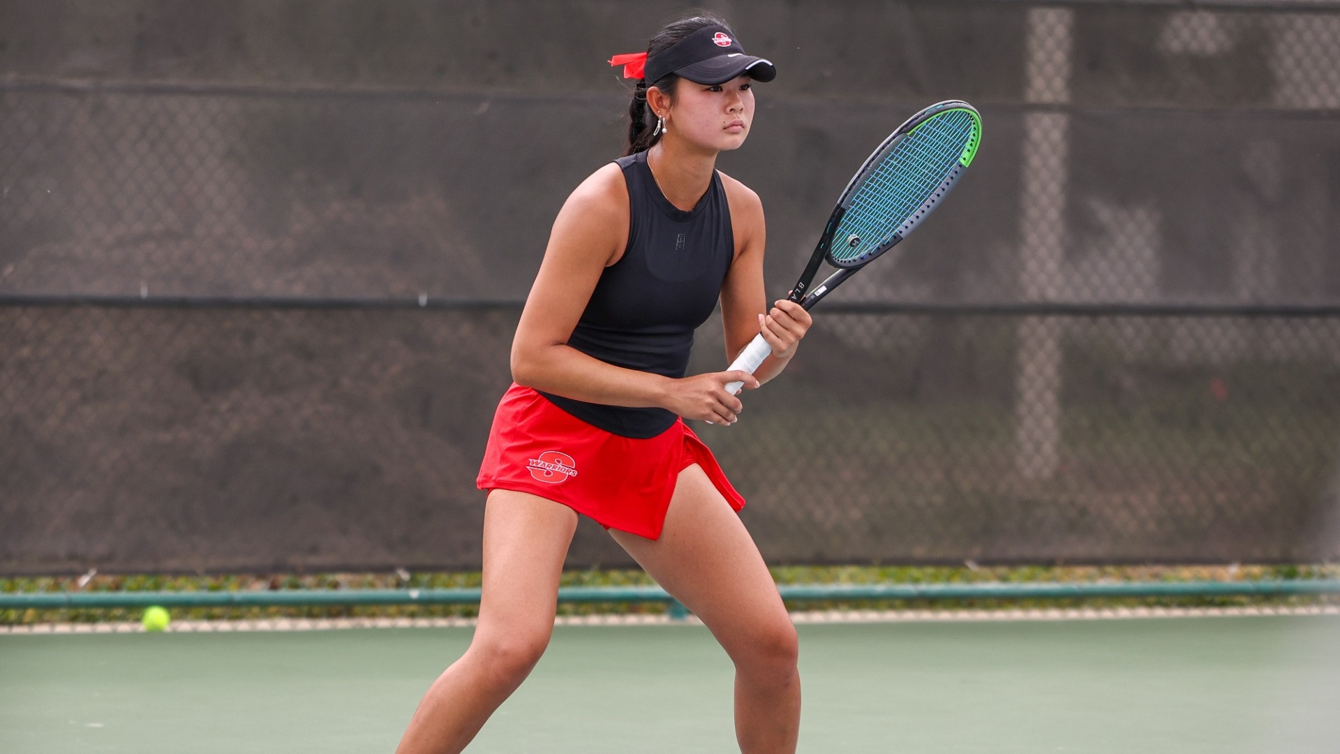 Emi Mikami prepares to return a shot during a Stan State women’s tennis match.