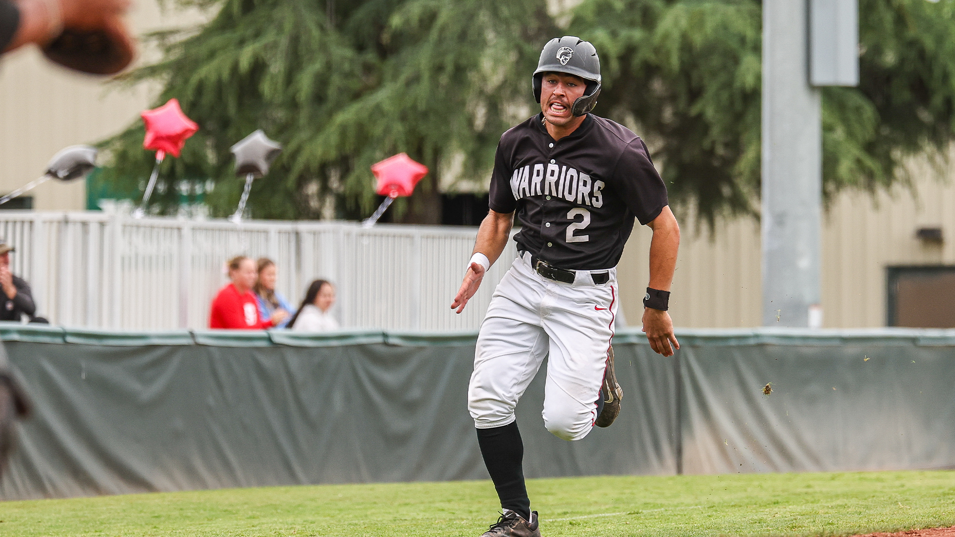 Kian Sanchez scoring a run in last week's home finale vs. CSUDH