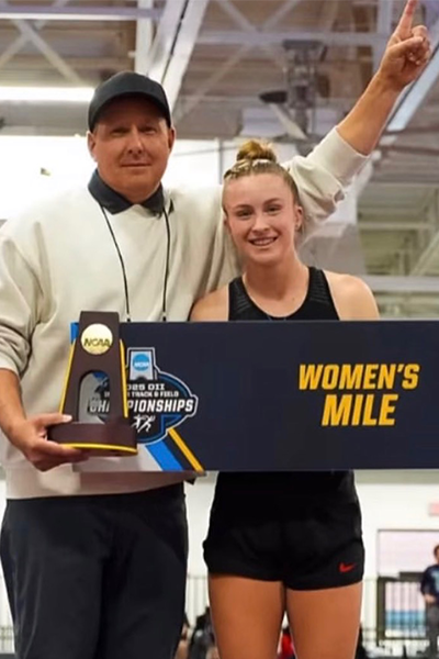 Coach Darren Holman with Five-Time All-American Annie Wild