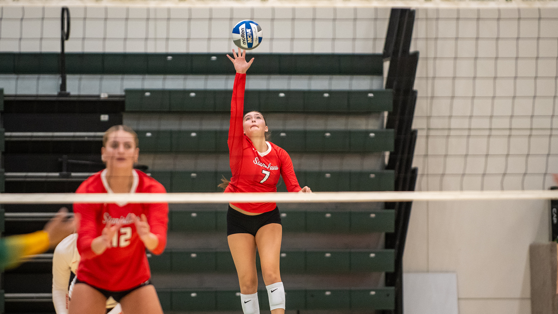 action of Gonzales serving at a recent match