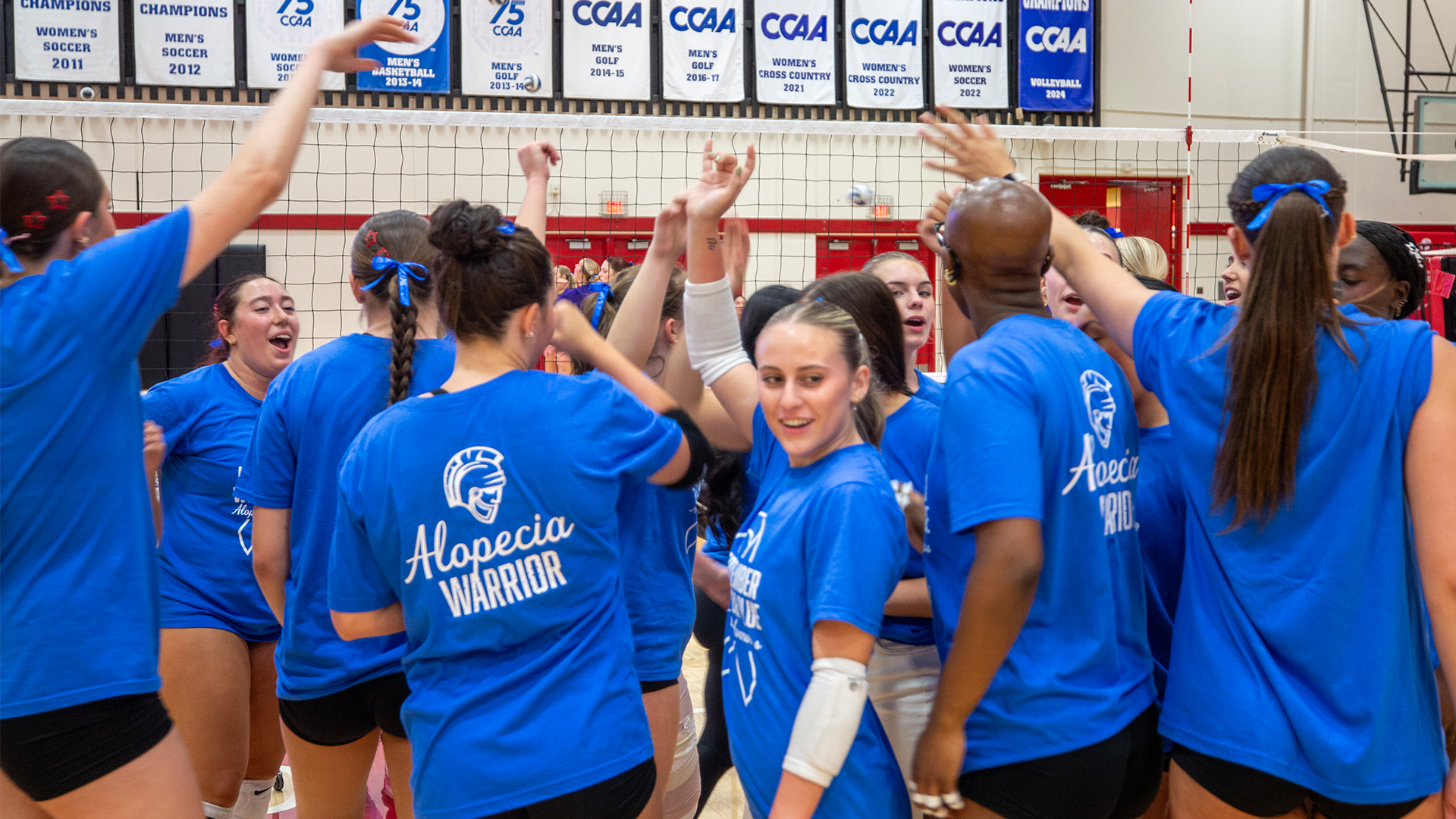 shot of Warriors in their blue shirts recognizing Alopecia Awareness 