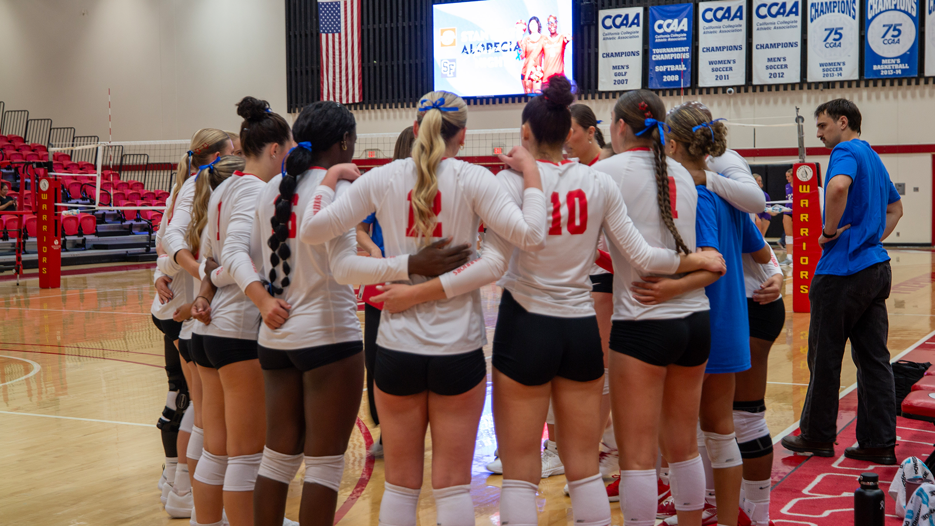 Warriors in a huddle in their home opener