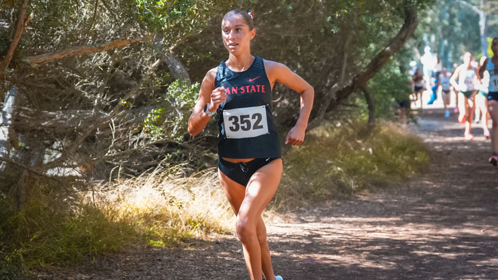 Action shot of Stevie Holguin running at the USF Invite