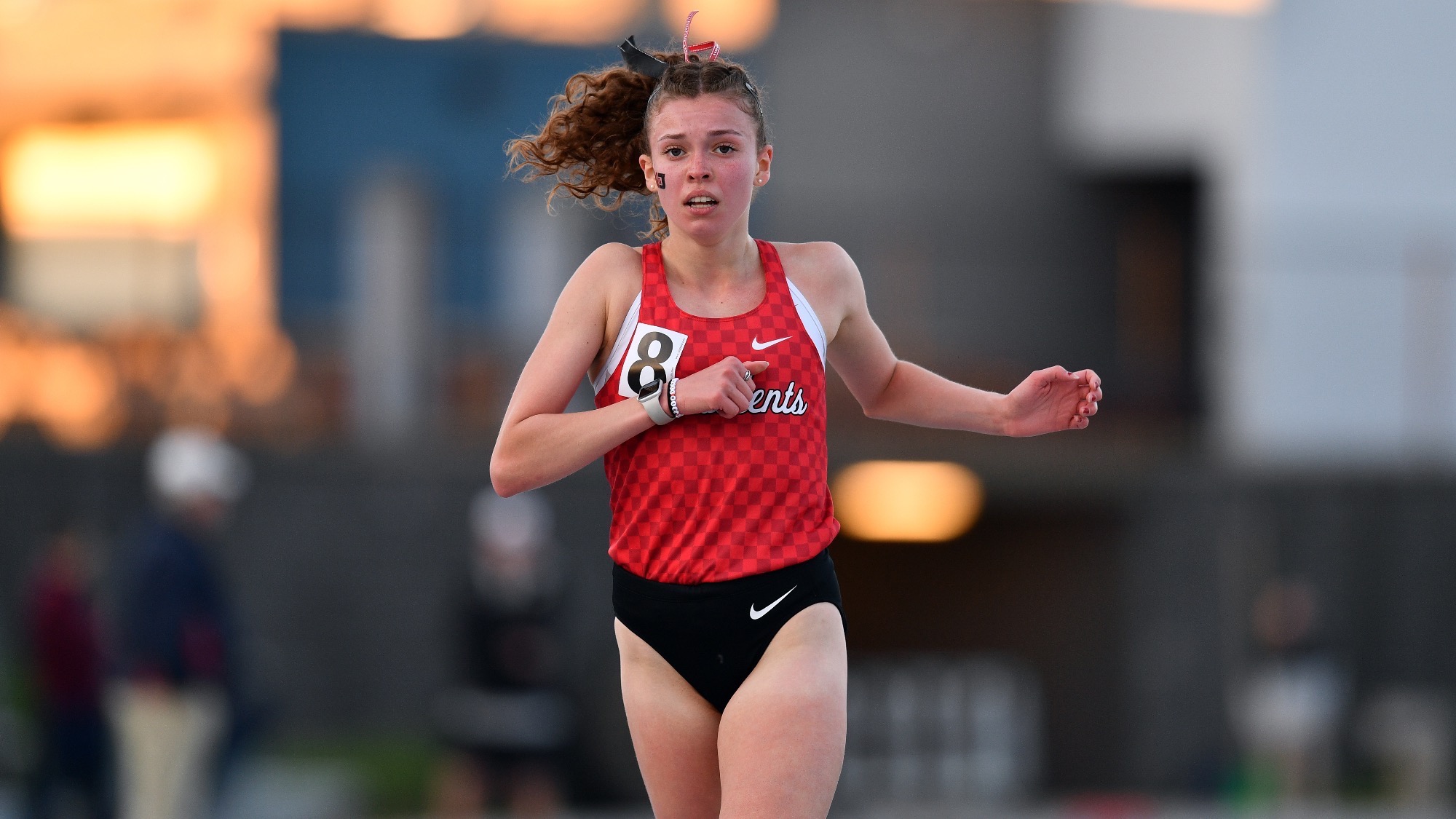 Claire Anderson reacts after crossing the finish line in the 10K at the 2024 PAC Outdoor Championships