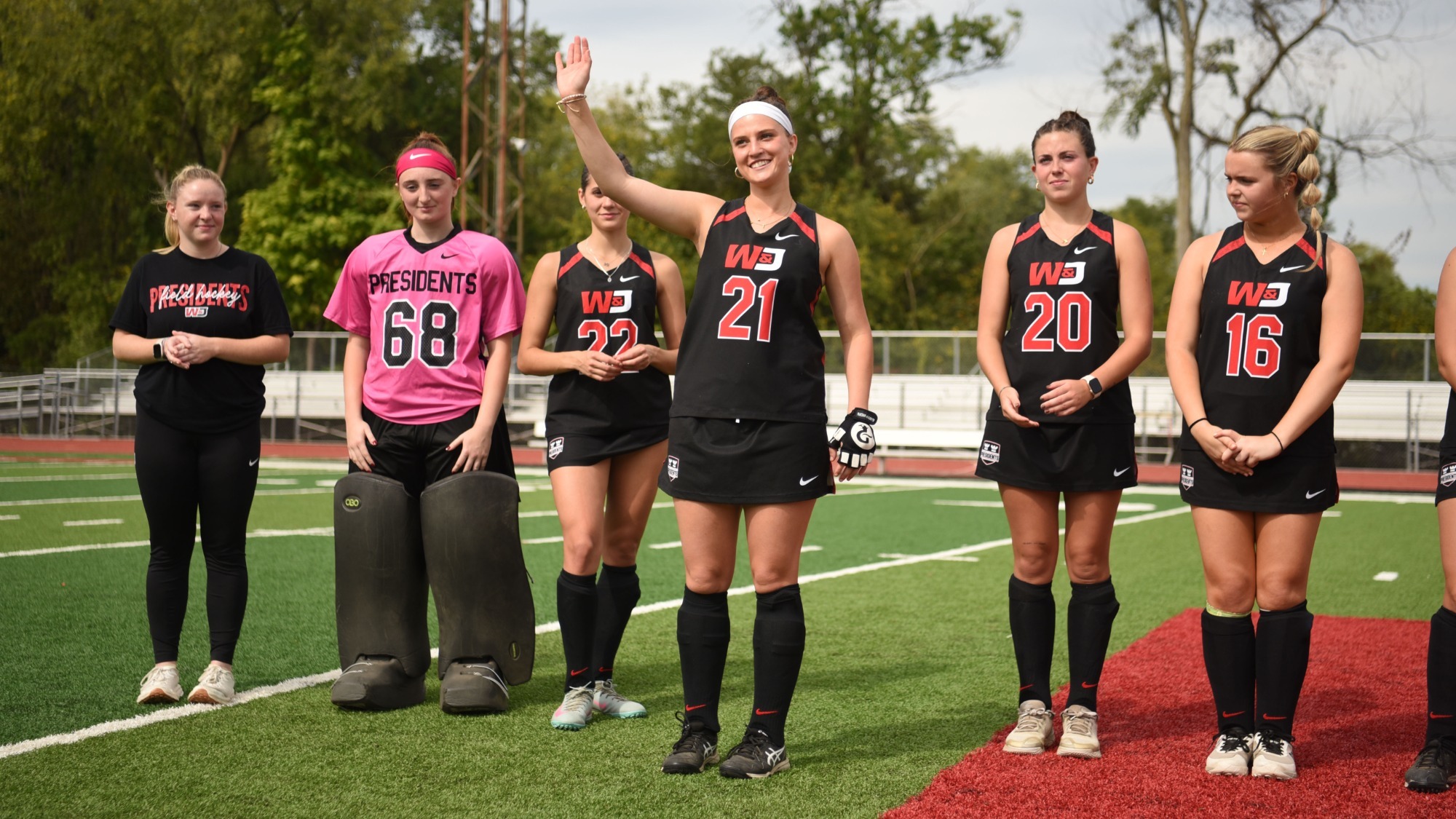 Lily Giering waves to the crowd before the start of 2025 Senior Day vs. DePauw