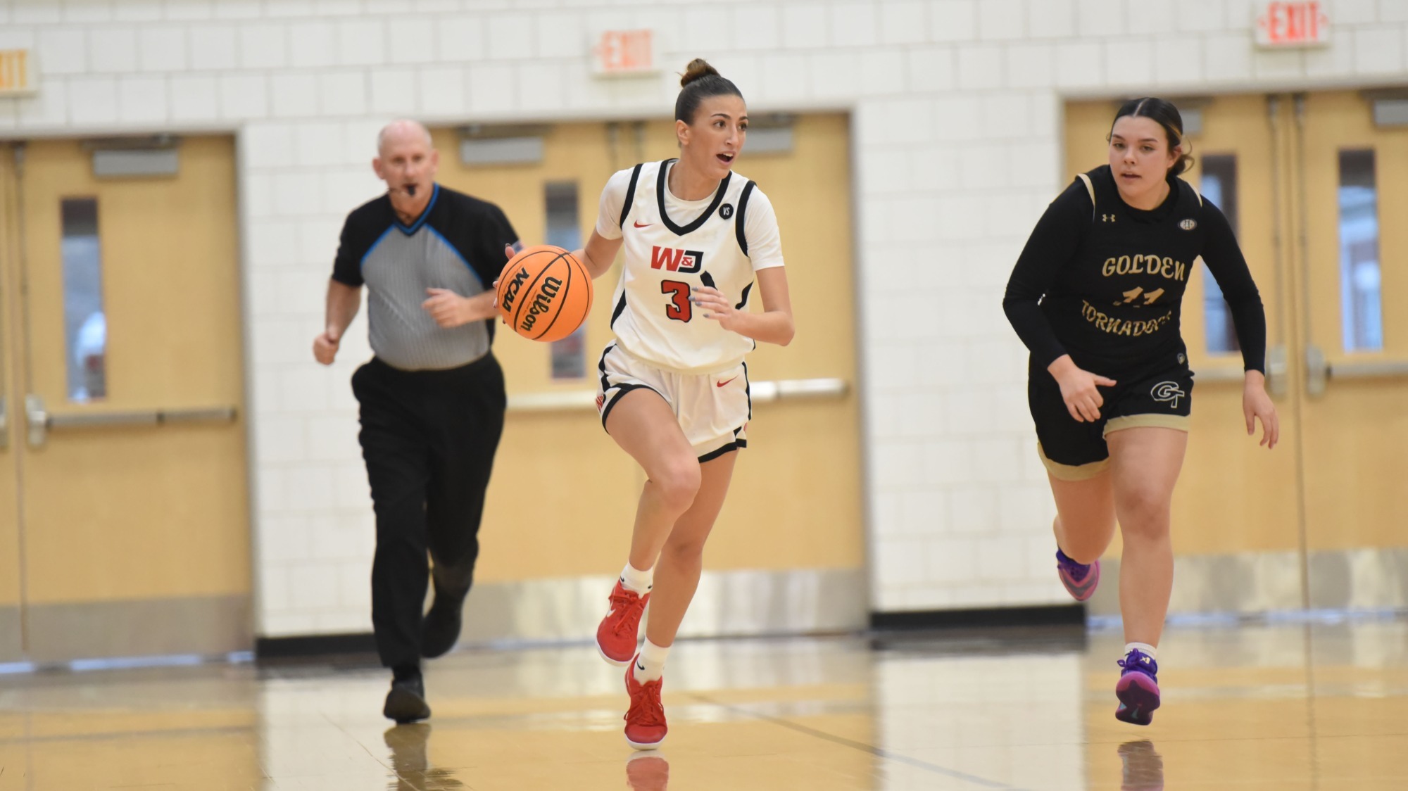Stellanie Loutsion dribbles up court versus Geneva in a 2025-26 game