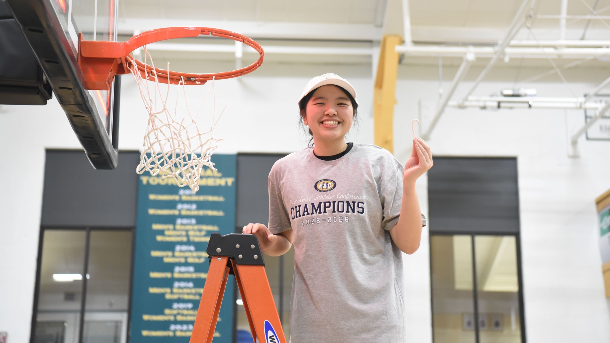 Jaden Wan cuts down the nets after W&J's 2026 PAC Championship Game victory
