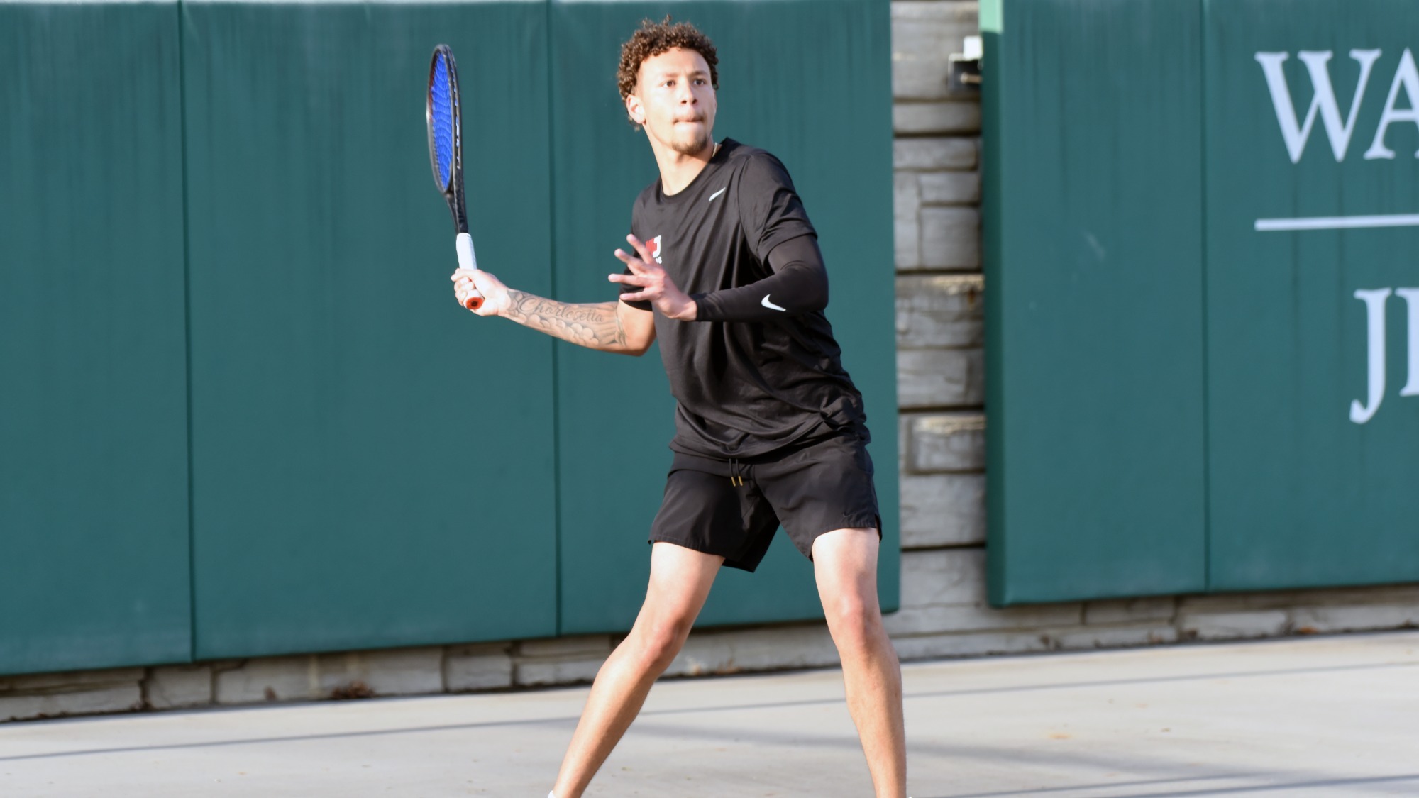 Nate Clarke shown readying to receive a ball in a 2026 match
