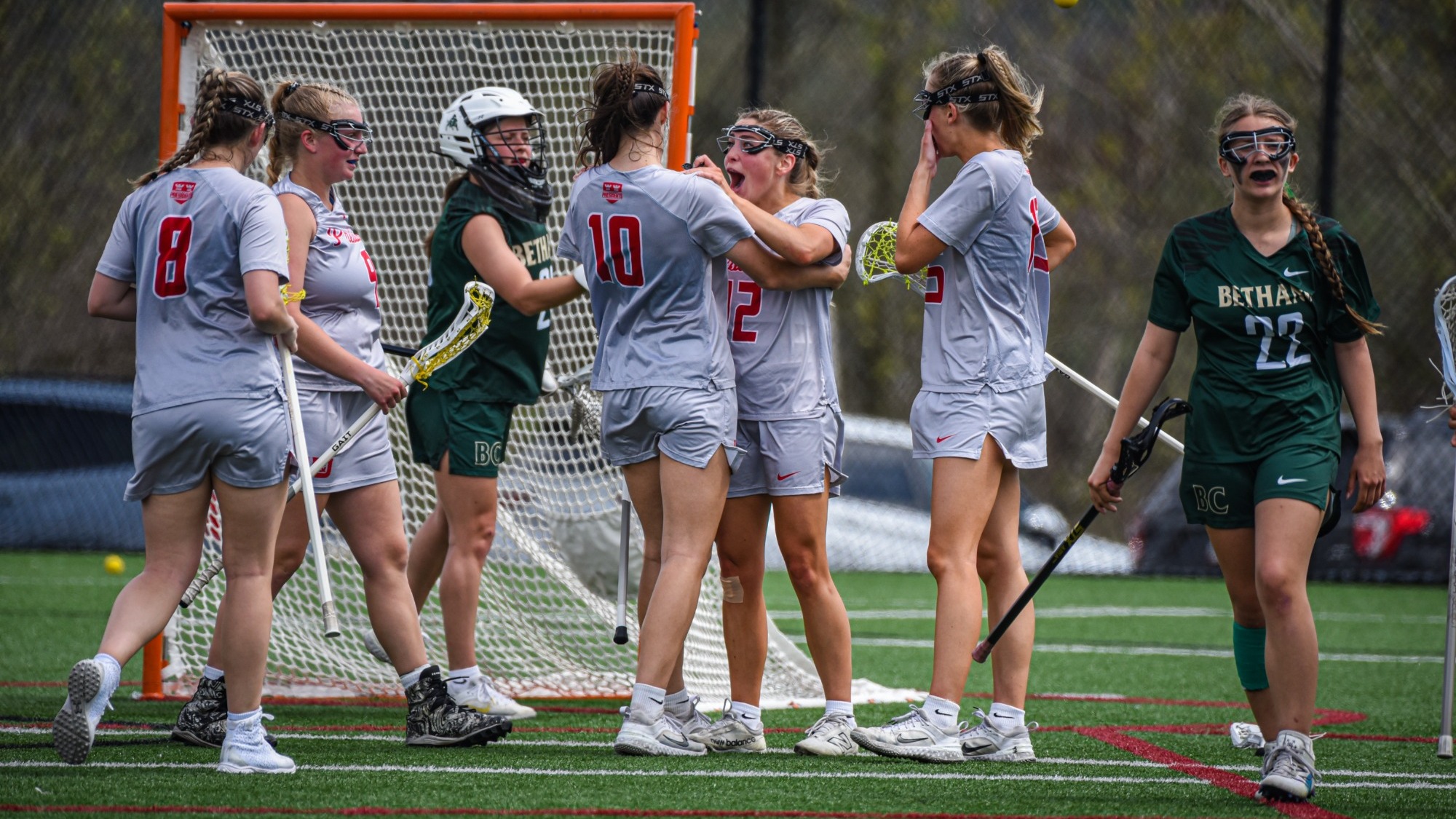 WLAX celebrating a goal vs Bethany on senior day 2026
