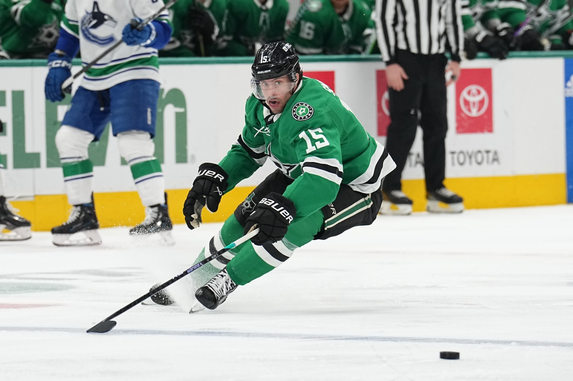 DALLAS, TX - DECEMBER 21: Craig Smith #15 of the Dallas Stars handles the puck against the Vancouver Canucks at the American Airlines Center on December 21, 2023 in Dallas, Texas. (Photo by Glenn James/NHLI via Getty Images)