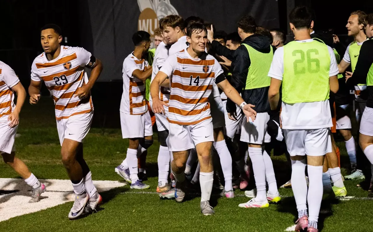 Men's soccer celebrates a goal