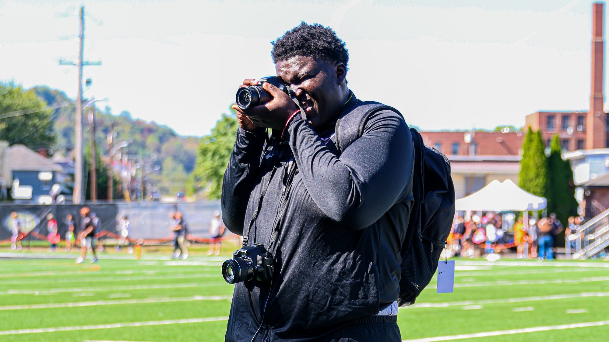 Boastas Kwabiah Taking A picture at football game