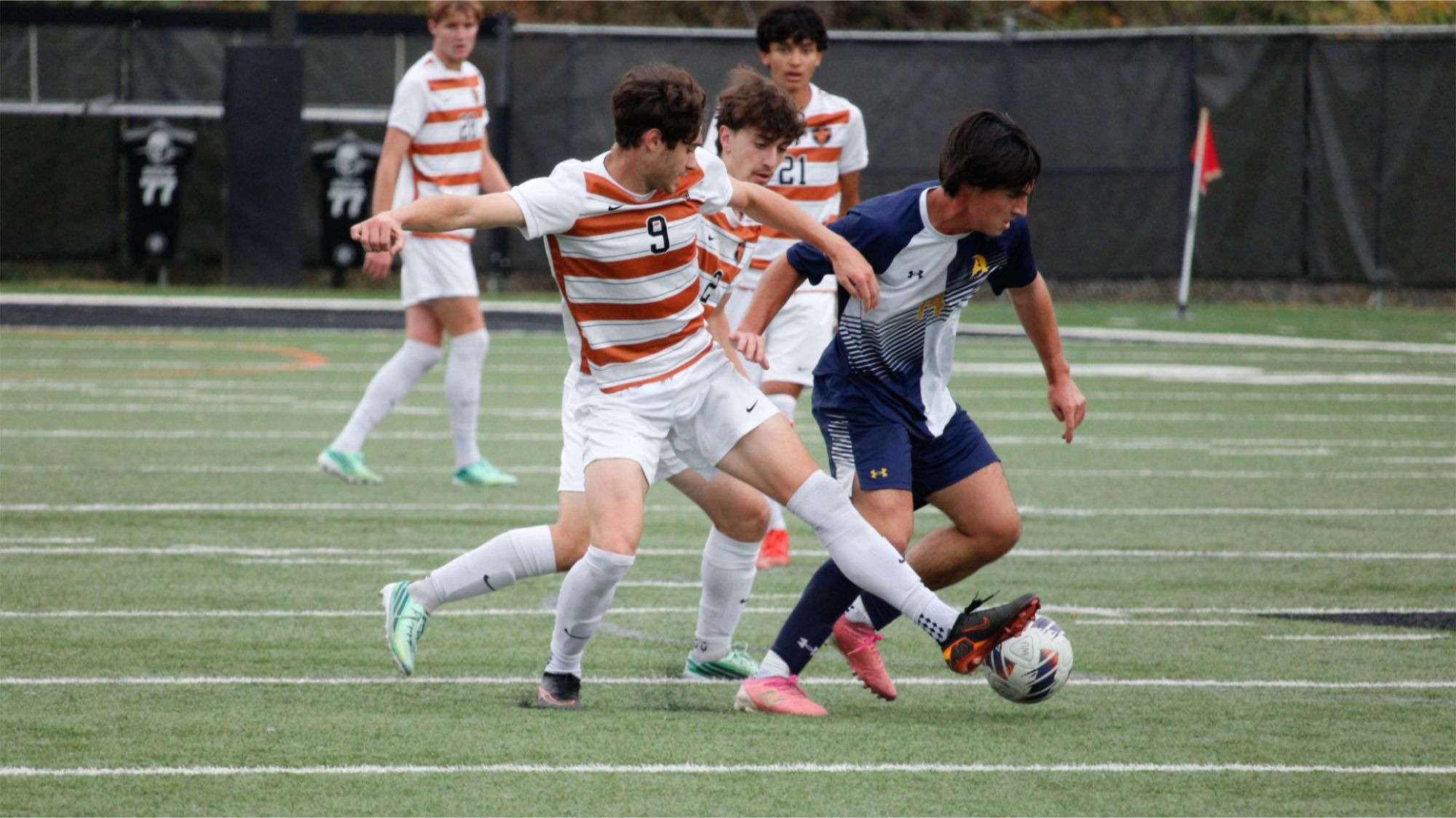 Waynesburg's Josh Smith battles an opponent from Allegheny for the ball