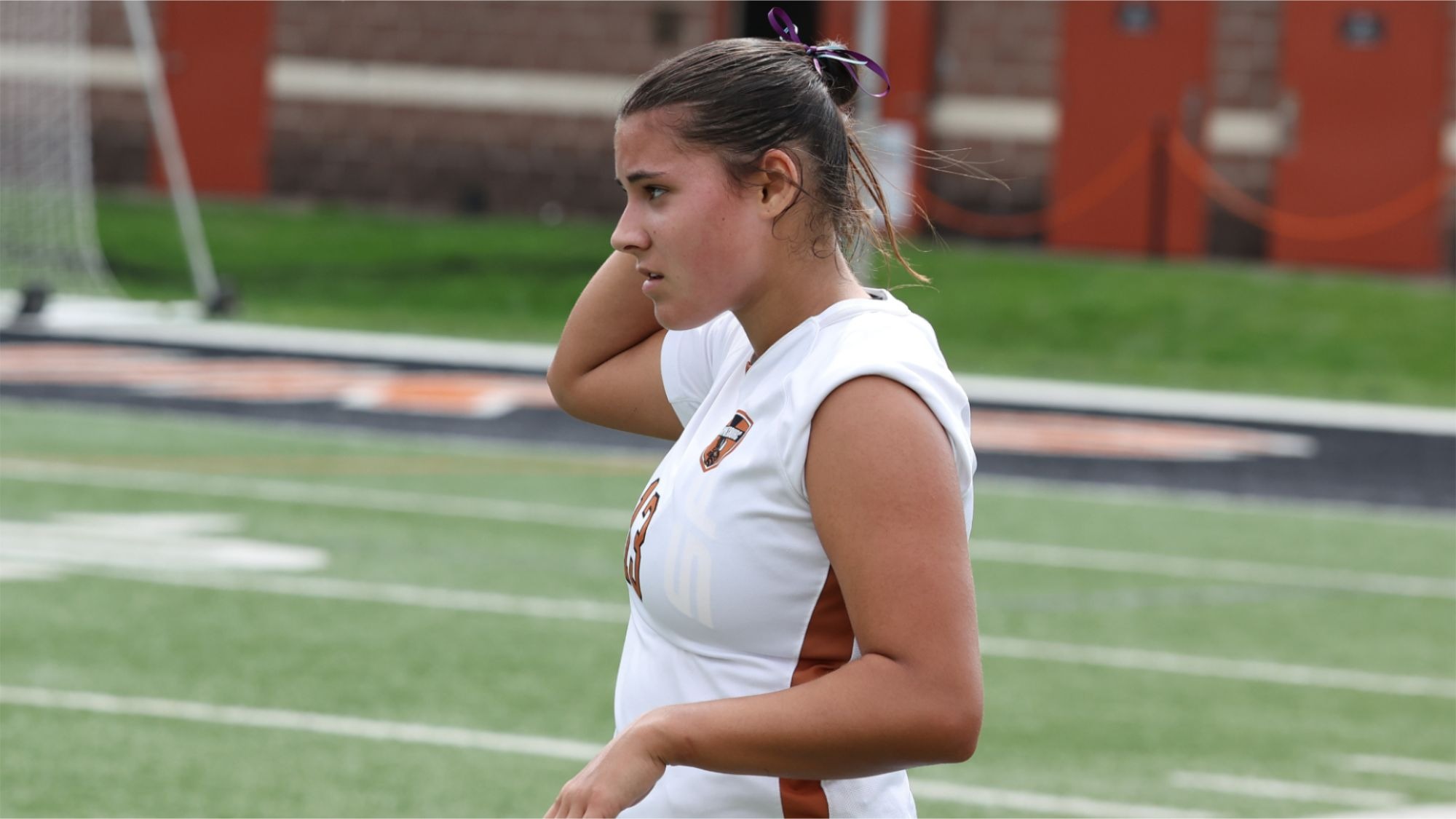 A closeup of Amanda Pepe shows her looking off into the distance