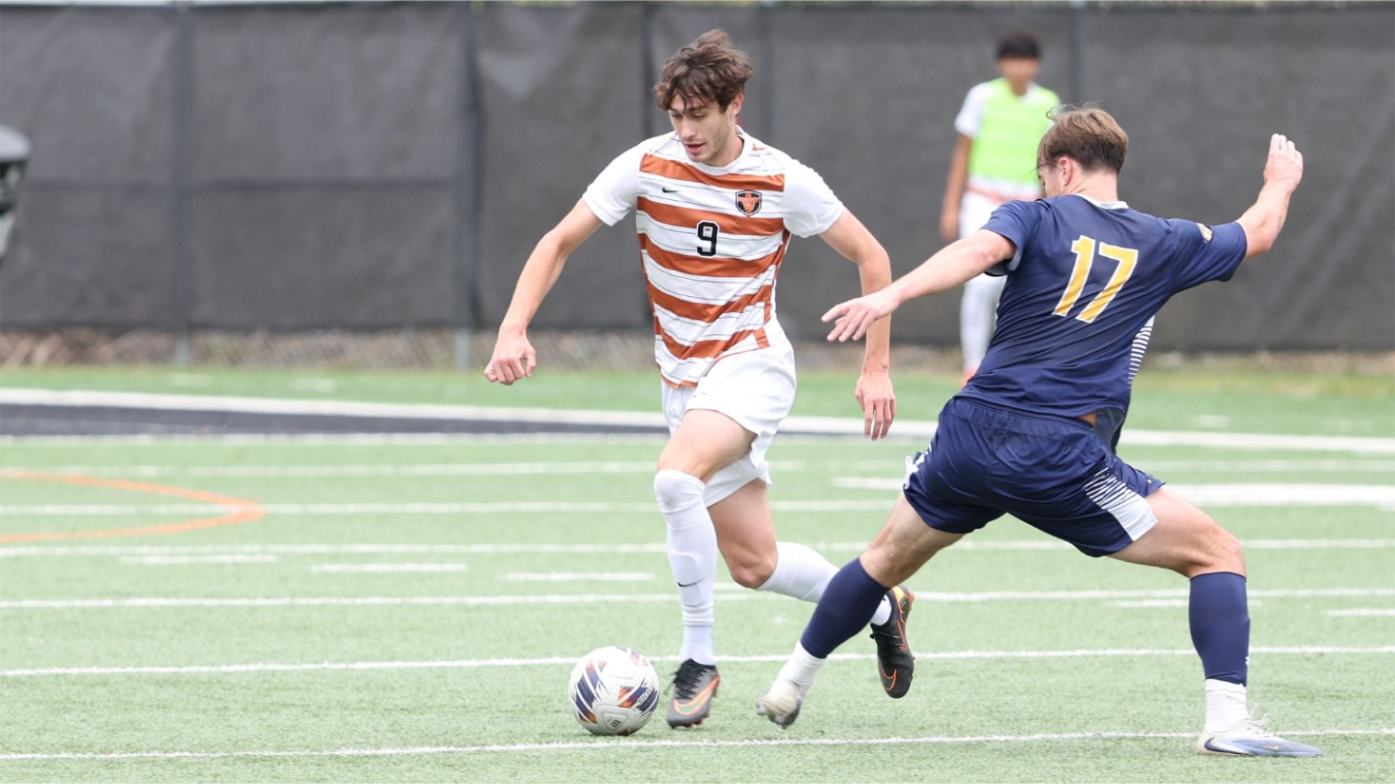 Waynesburg's Josh Smith dribbles the soccer ball against a defender