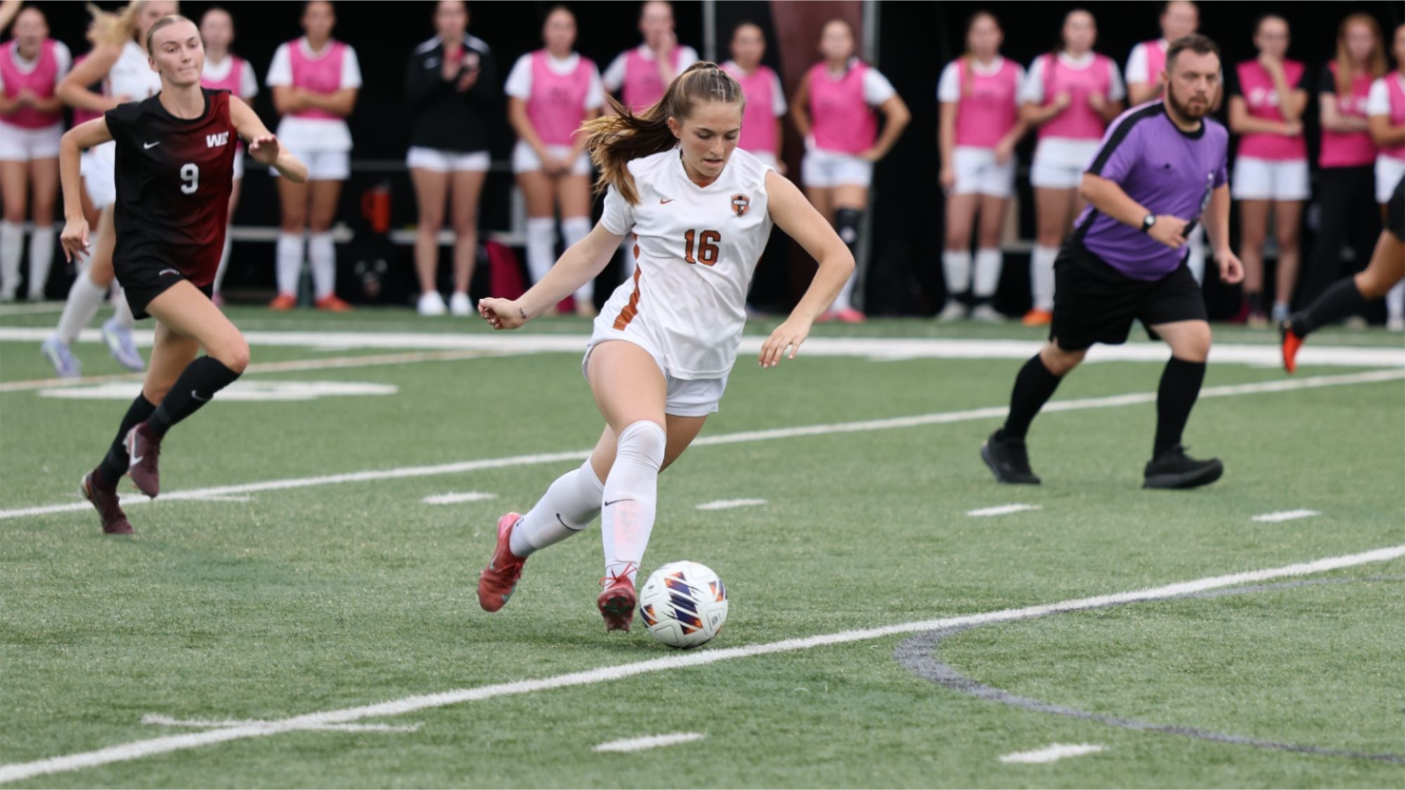 Waynesburg's Kennedy Prestidge dribbles the ball up field