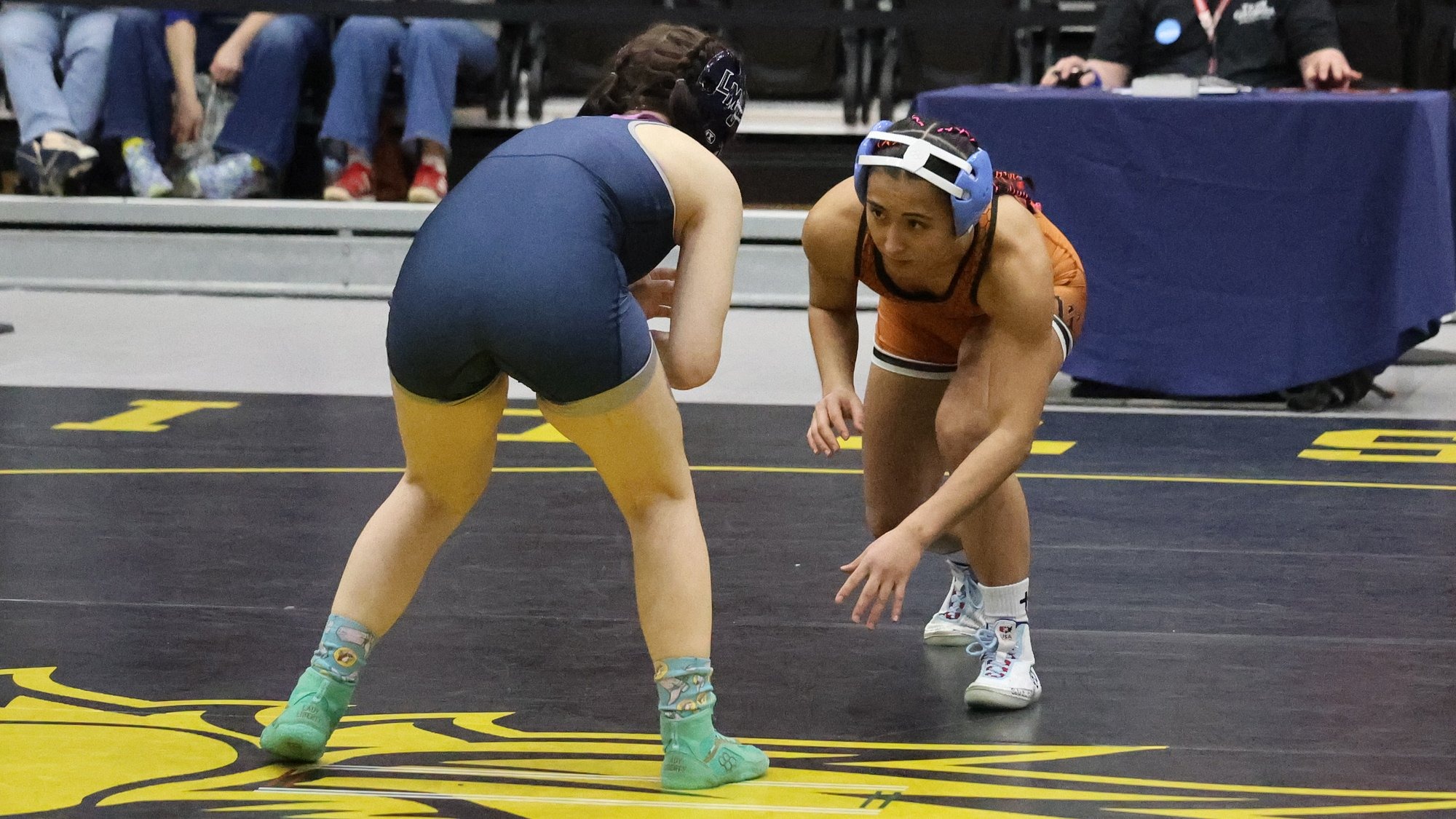 Curitti wrestling on her feet