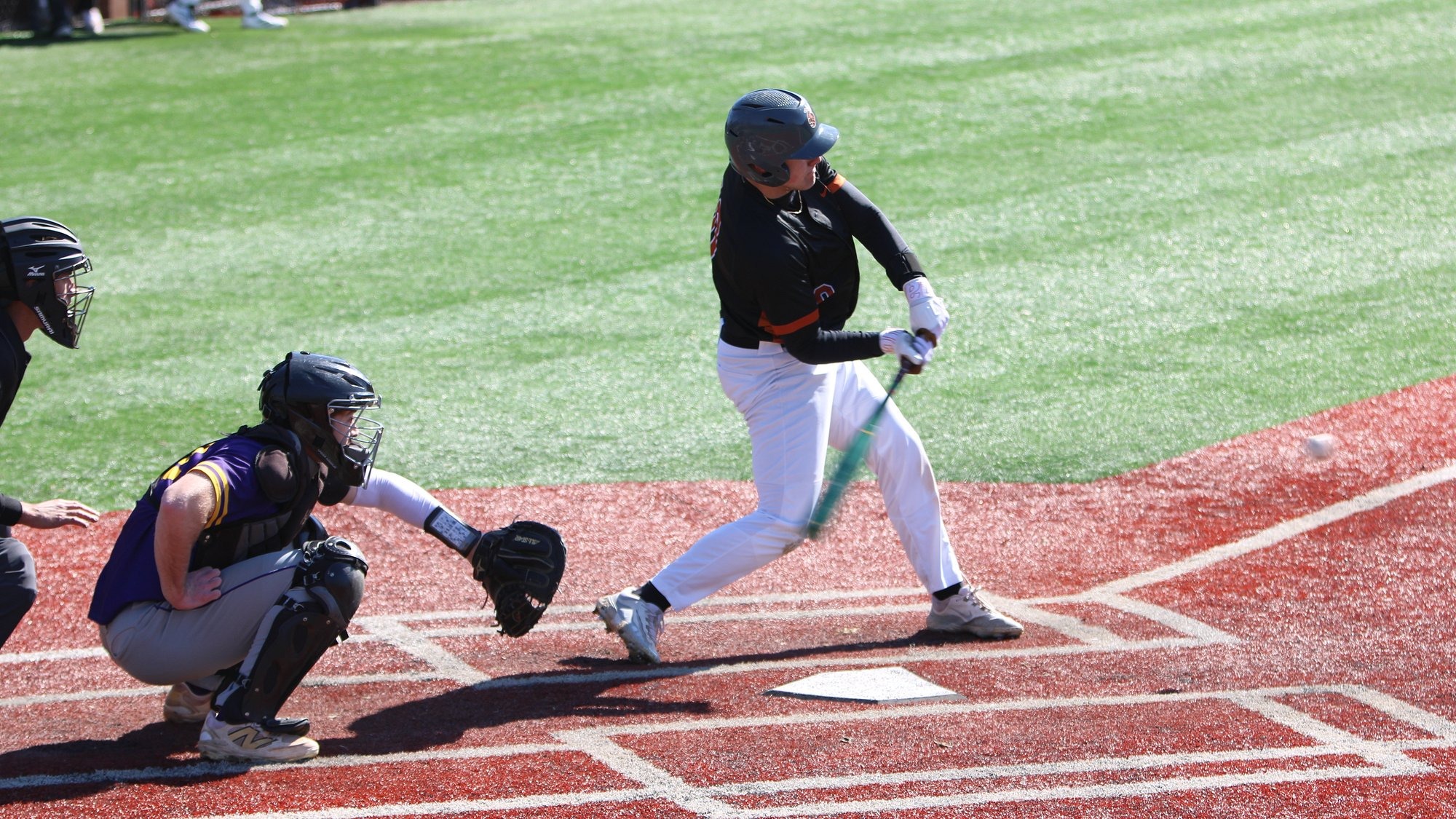 Jacket player makes contact with a pitch