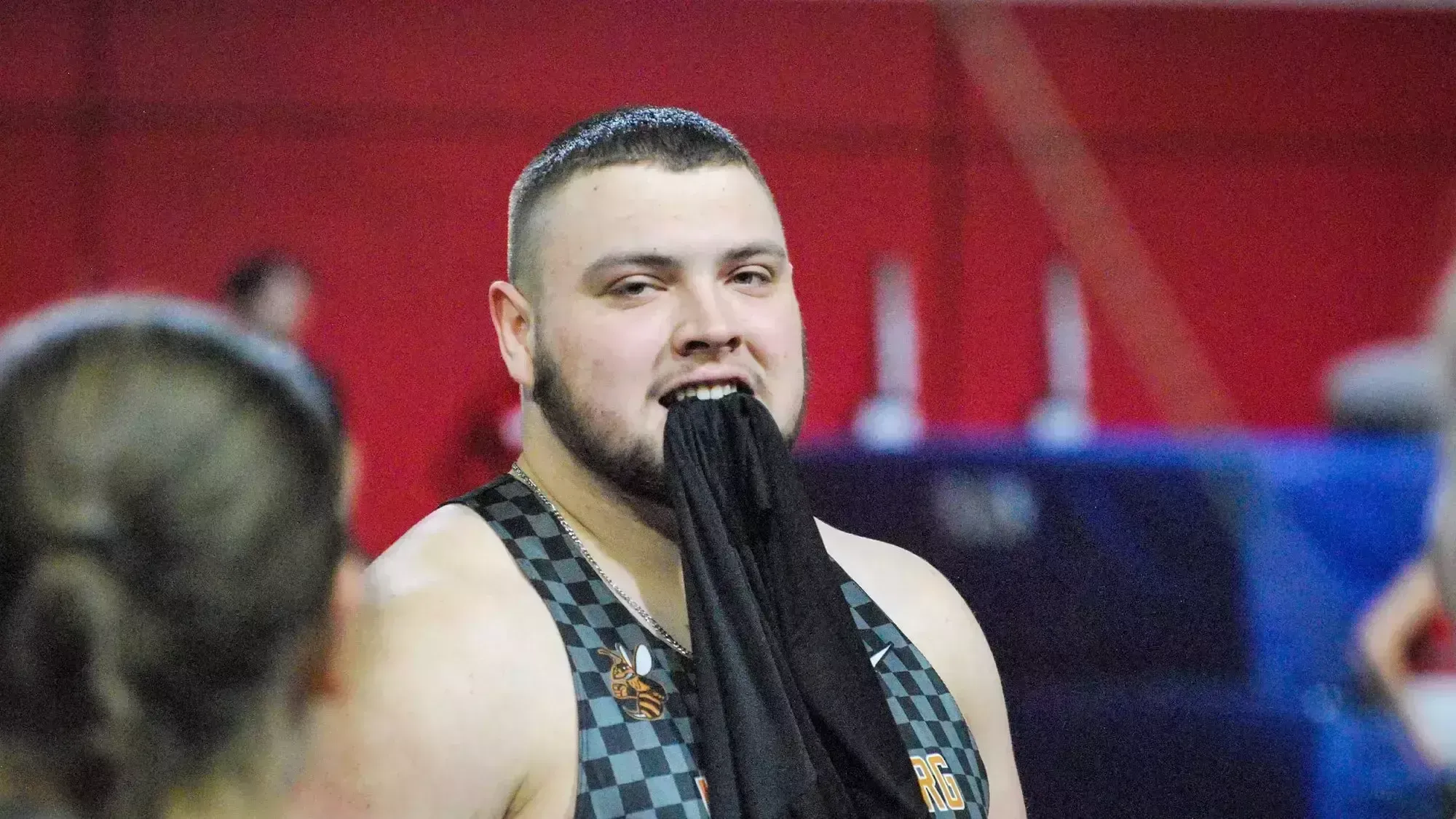 Harker playfully holding a shirt in his teeth