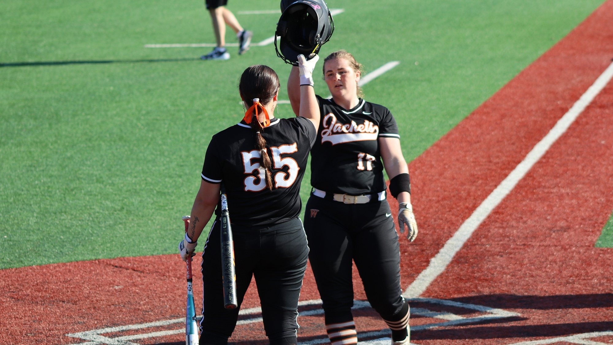 Corbin and Kelly meet at home plate after homerun