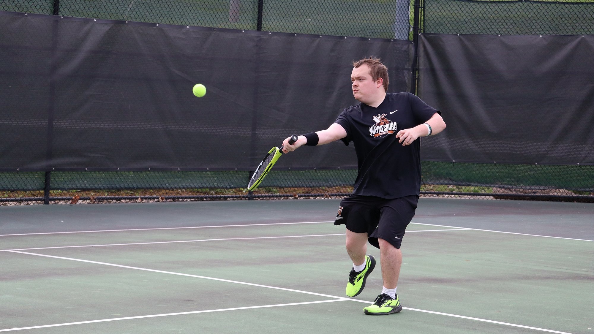 Thomas Torcaso hitting a forehand return