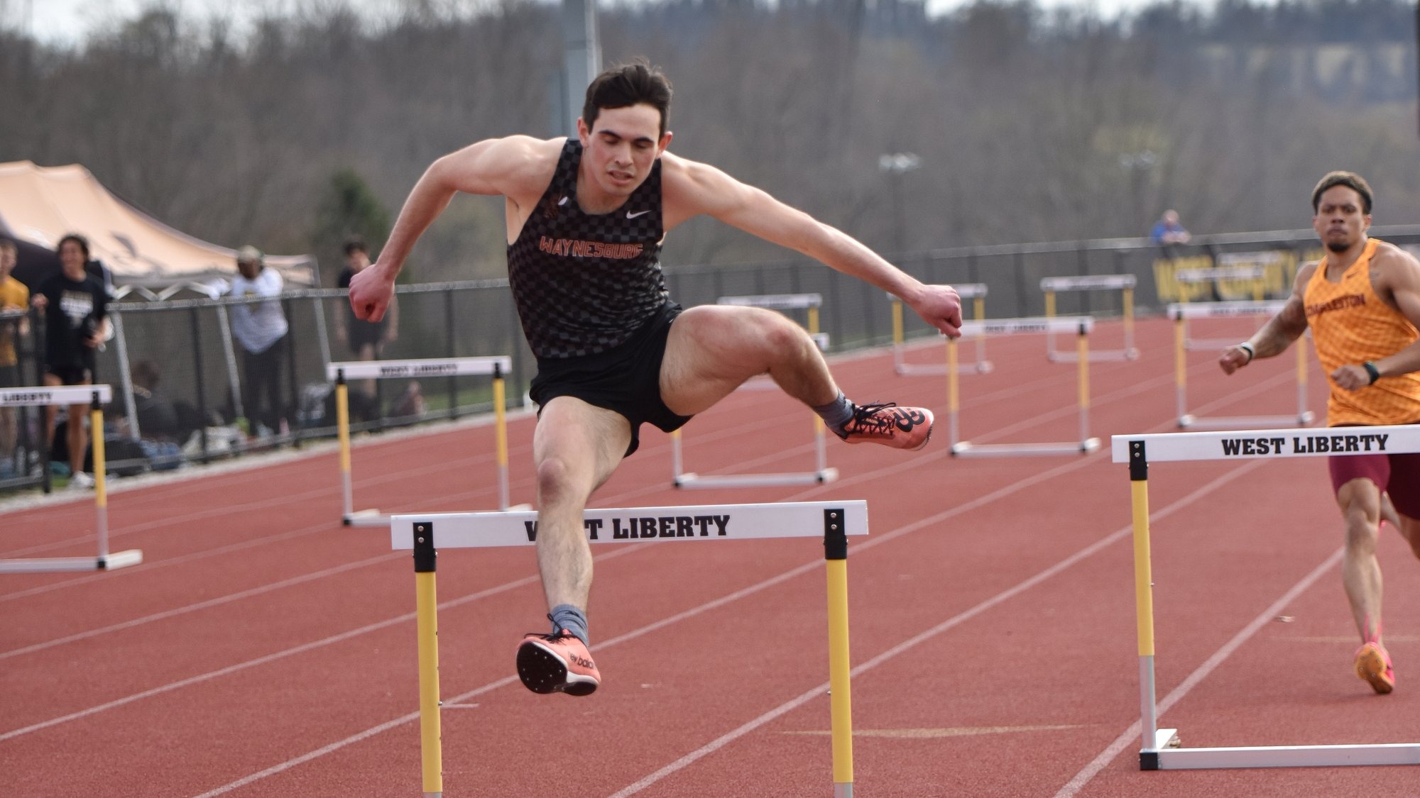 Kyle Casella competing in the hurdles