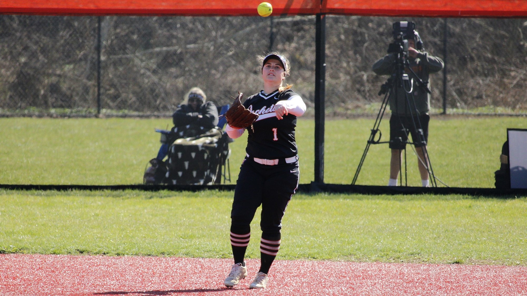 Bella DeMark throwing the ball in from the outfield