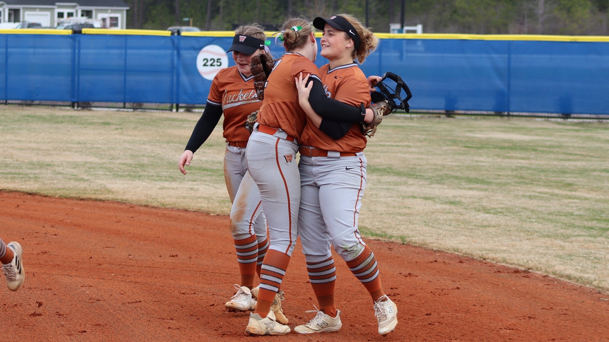 Players hug on the field