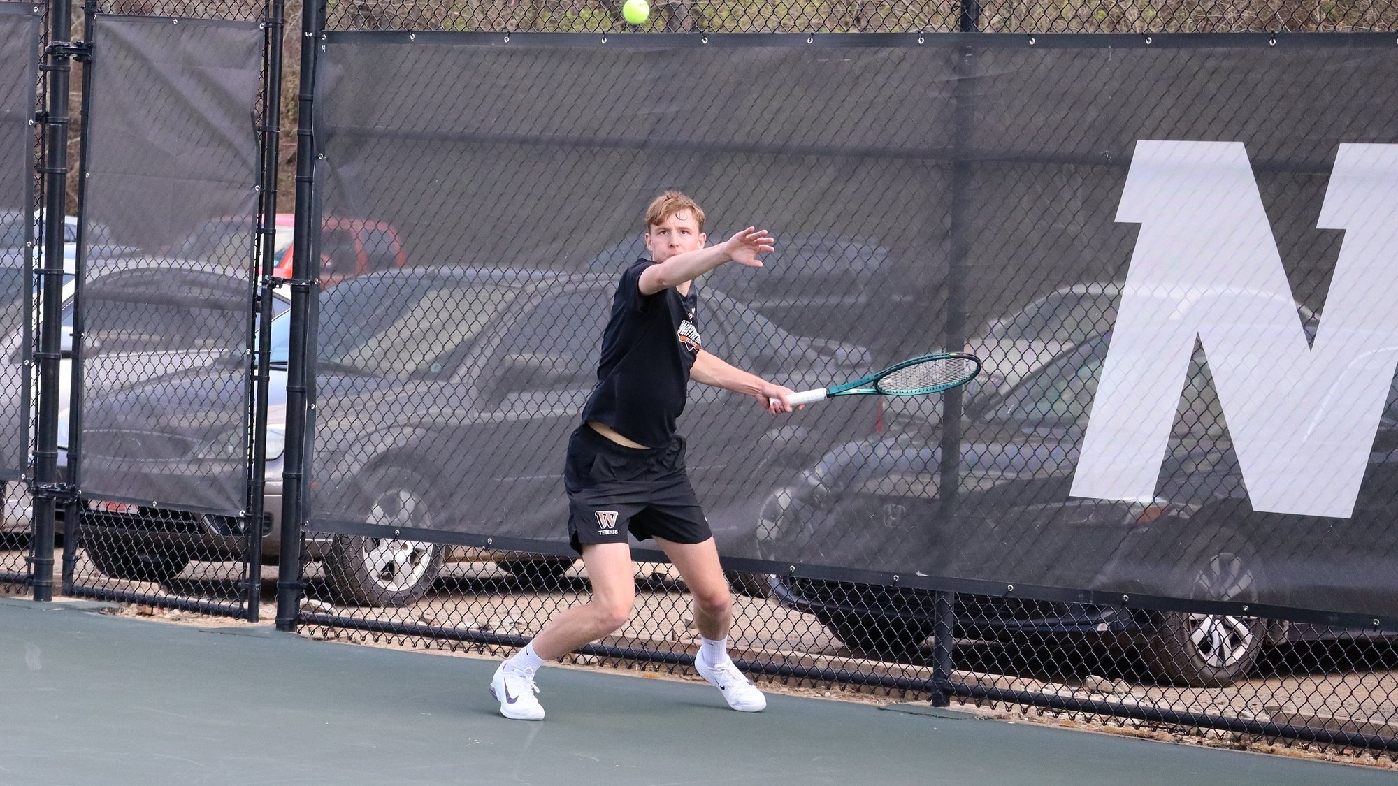 Noah Biser preparing to return a volley