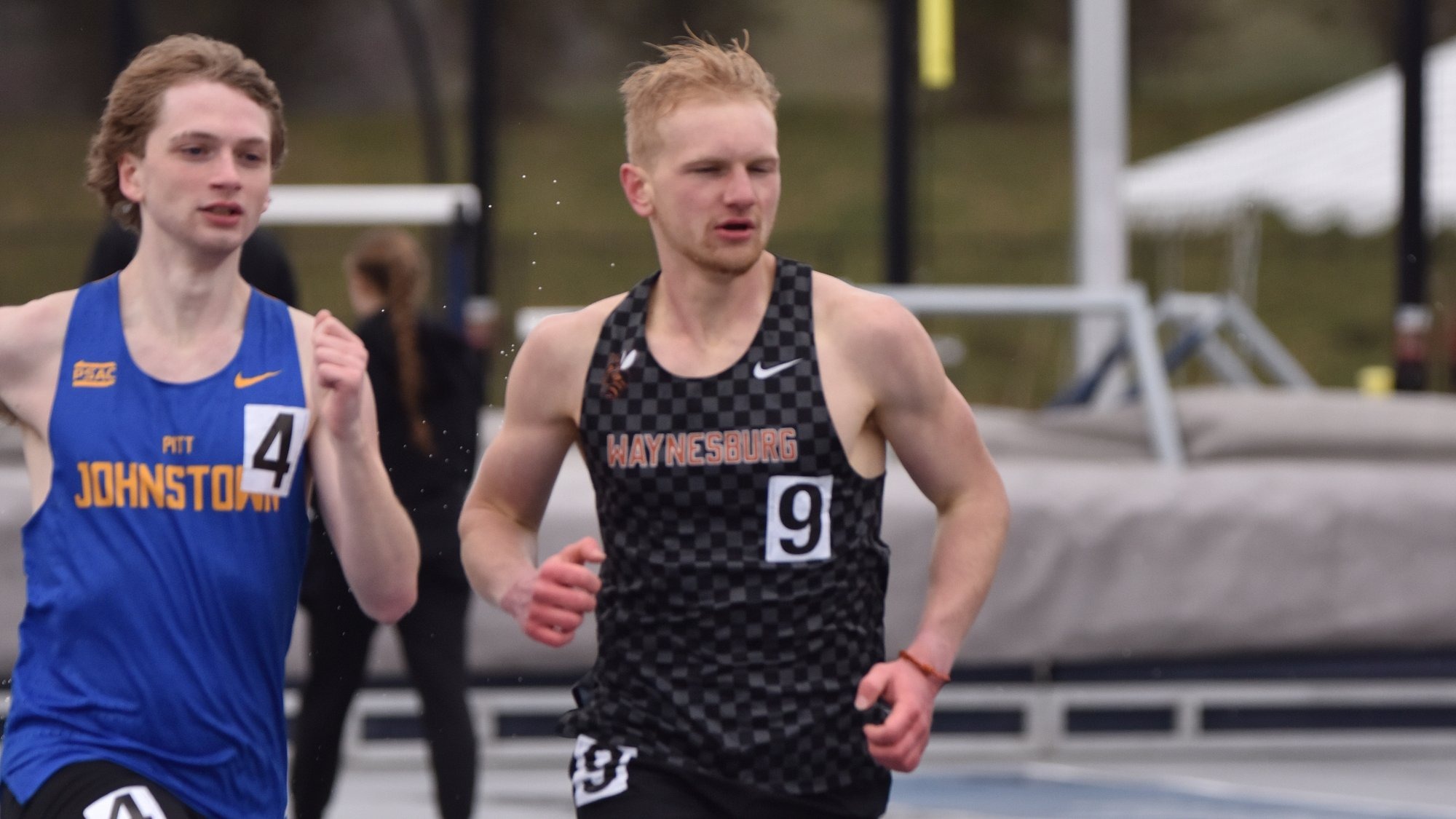 Ethan Wilson running in the rain