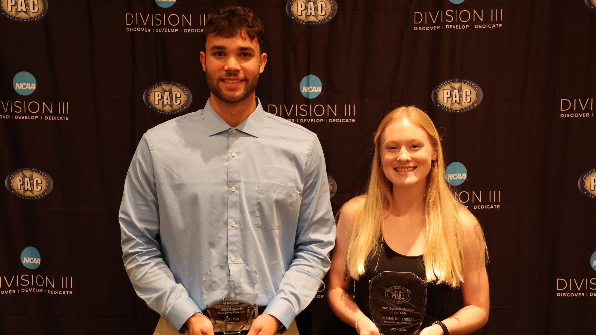 Jalen Goins and Regan Mittendorf stand with their PAC S-A of the Year Trophies