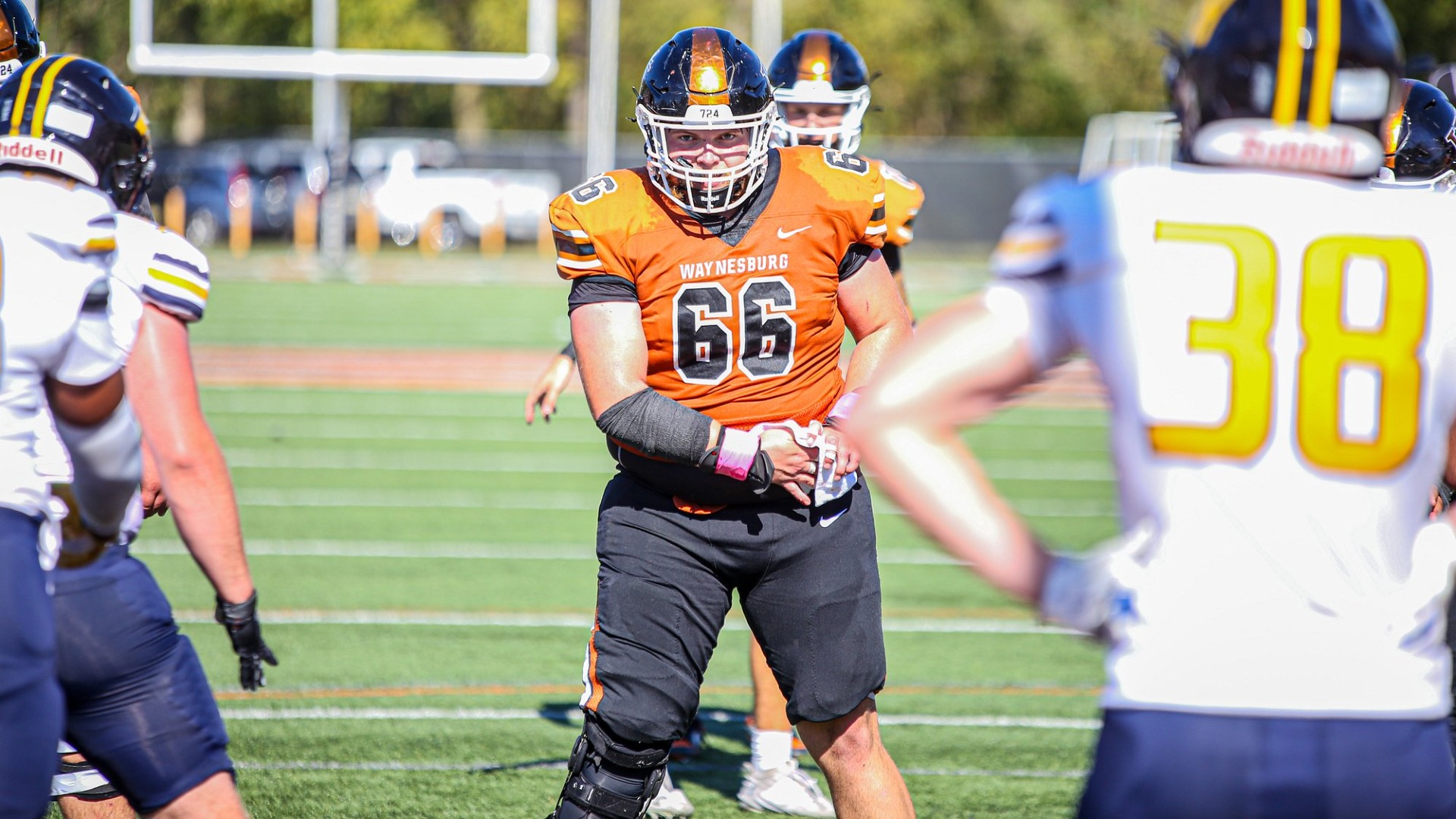 Waynesburg center Kory Ansell prepares to snap the football for a play against Allegheny