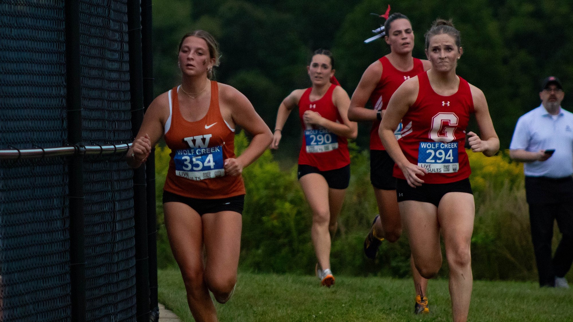 Several runners from Waynesburg and Grove City run around the bend in the course