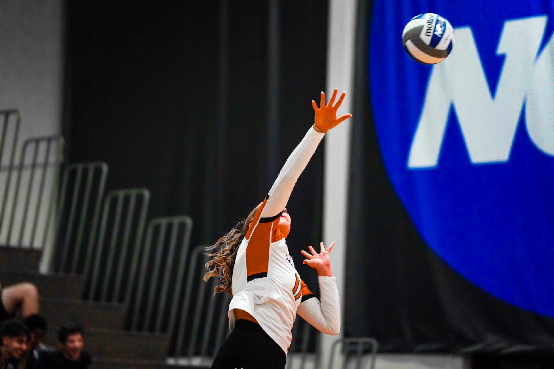 Waynesburg's Audrey Work winds up to attempt to spike the volleyball down over the net