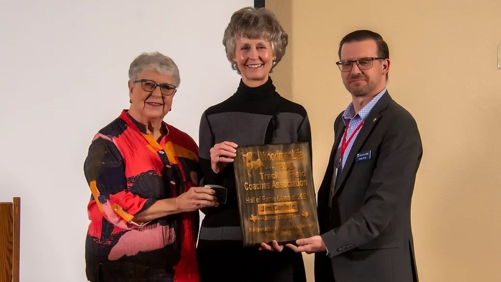 Jim Carlisle Family Accepting TTFCA Hall of Honor plaque