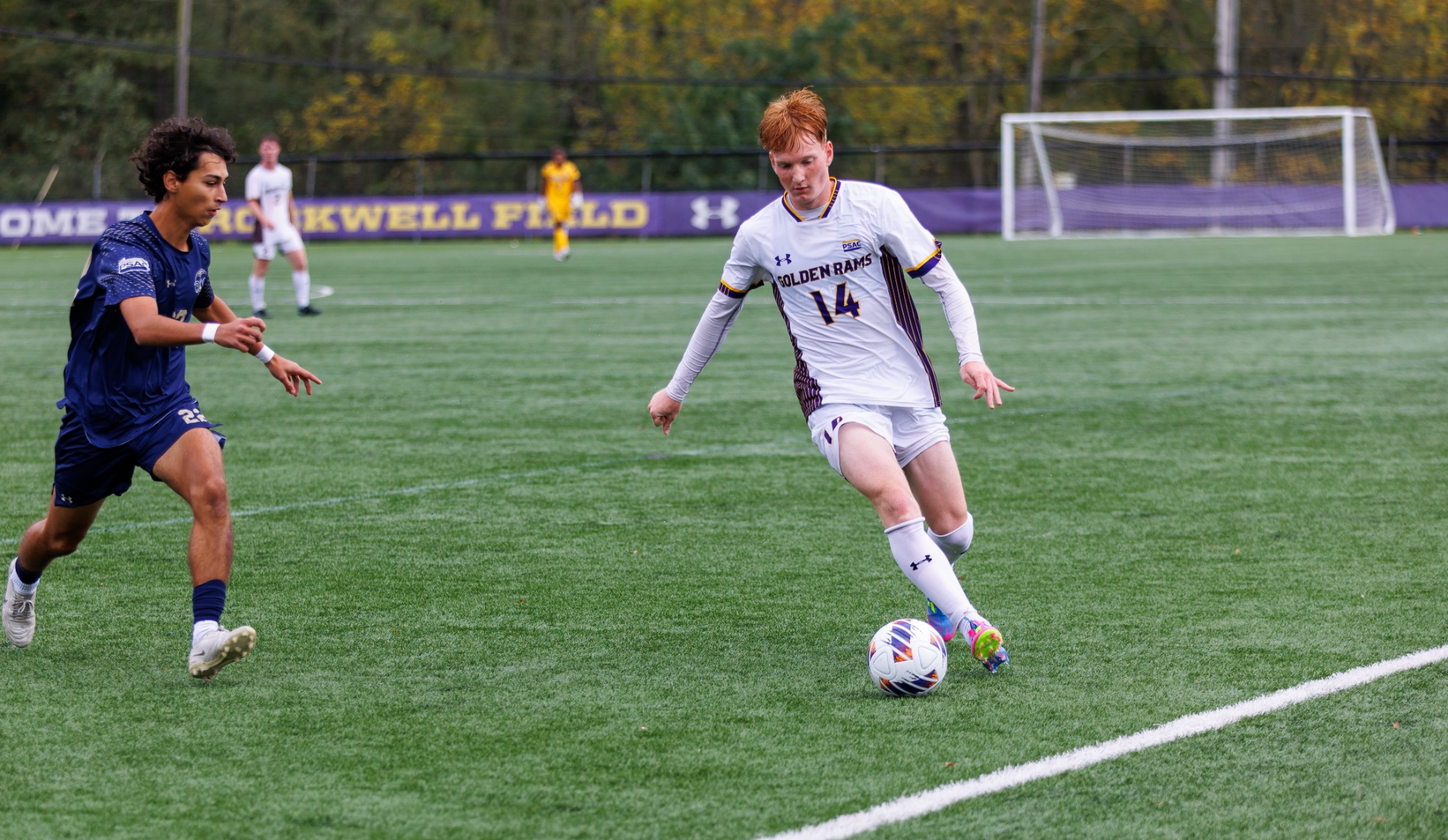 Peter Tichy dribbles along the sideline against Shepherd at Rockwell Field