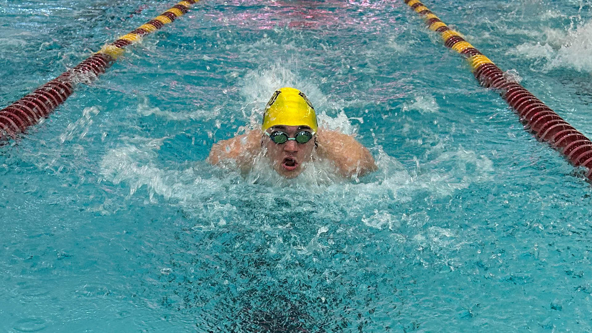 Nathan Noel swims at Bloomsburg