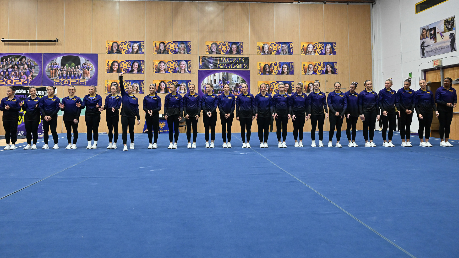 Gymnastics team lined up on Floor Exercise pre-meet