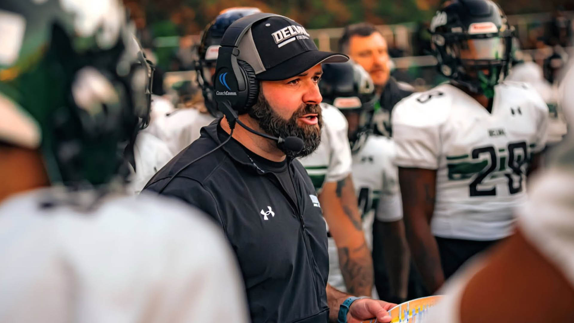 Mike Isgro in the huddle as DelVal coach