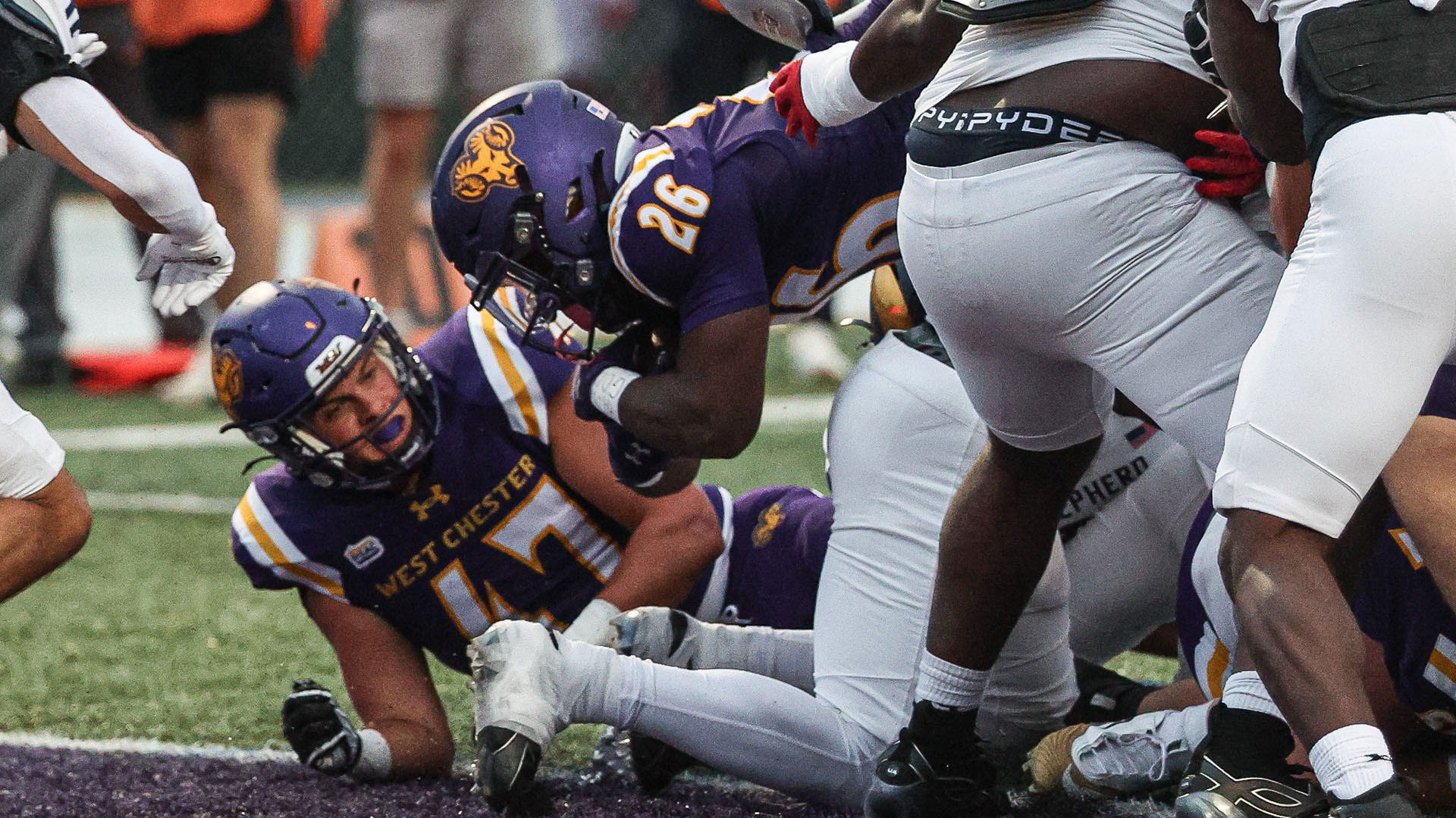 Isaiah Wright dives over the pile from one yard out to tie the game 7-7 against Shepherd at Farrell Stadium.