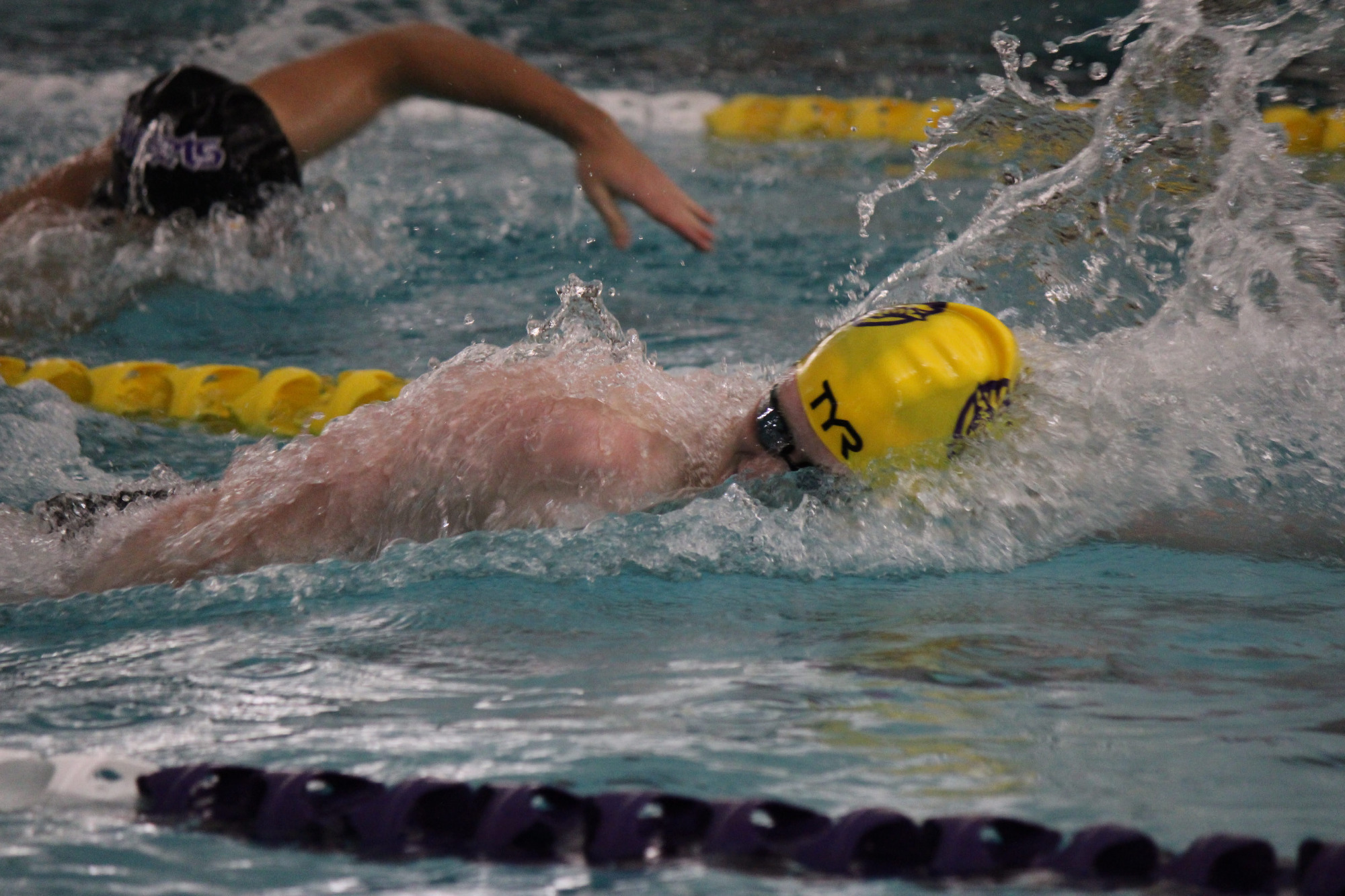 Till Schoeder swims the freestyle in his yellow TYR swim cap and goggles