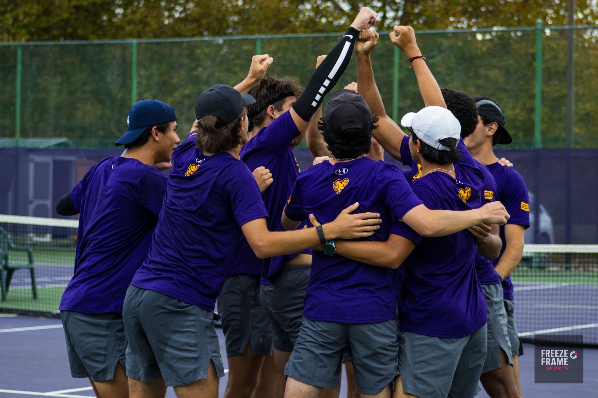 MEN'S TENNIS WEARING PURPLE UNIFORMS SHIRTS BREAKING HUDDLE ON COURT BEFORE MATCH VS ALBRIGHT