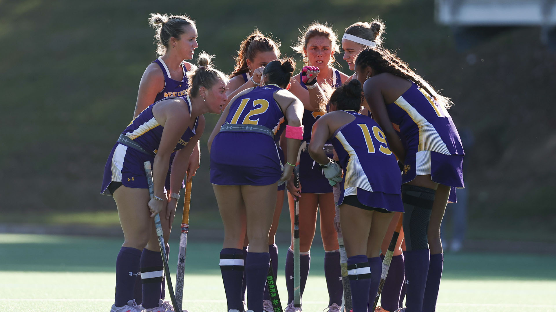 Field Hockey starters huddle on the field before the game against Kutztown at Vonnie Gros 